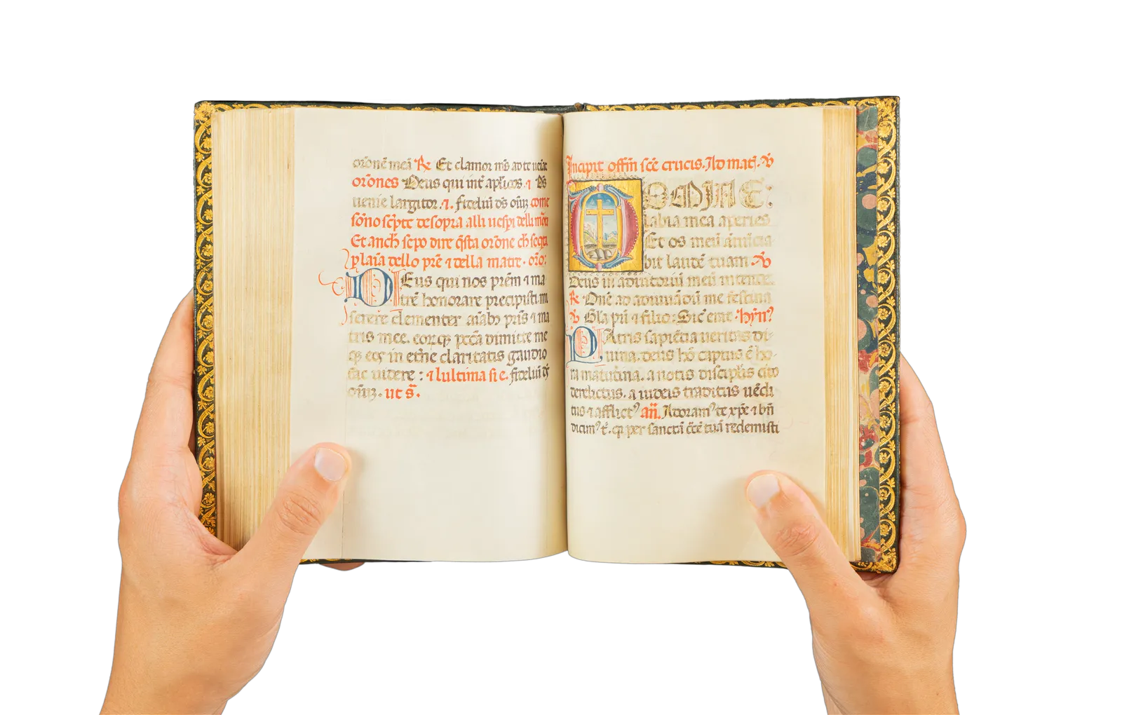 A richly illuminated medieval manuscript, Italian Book of Hours from Rome, signed and dated by the scribe, with many illuminations and decorative borders, with the page showing the cross