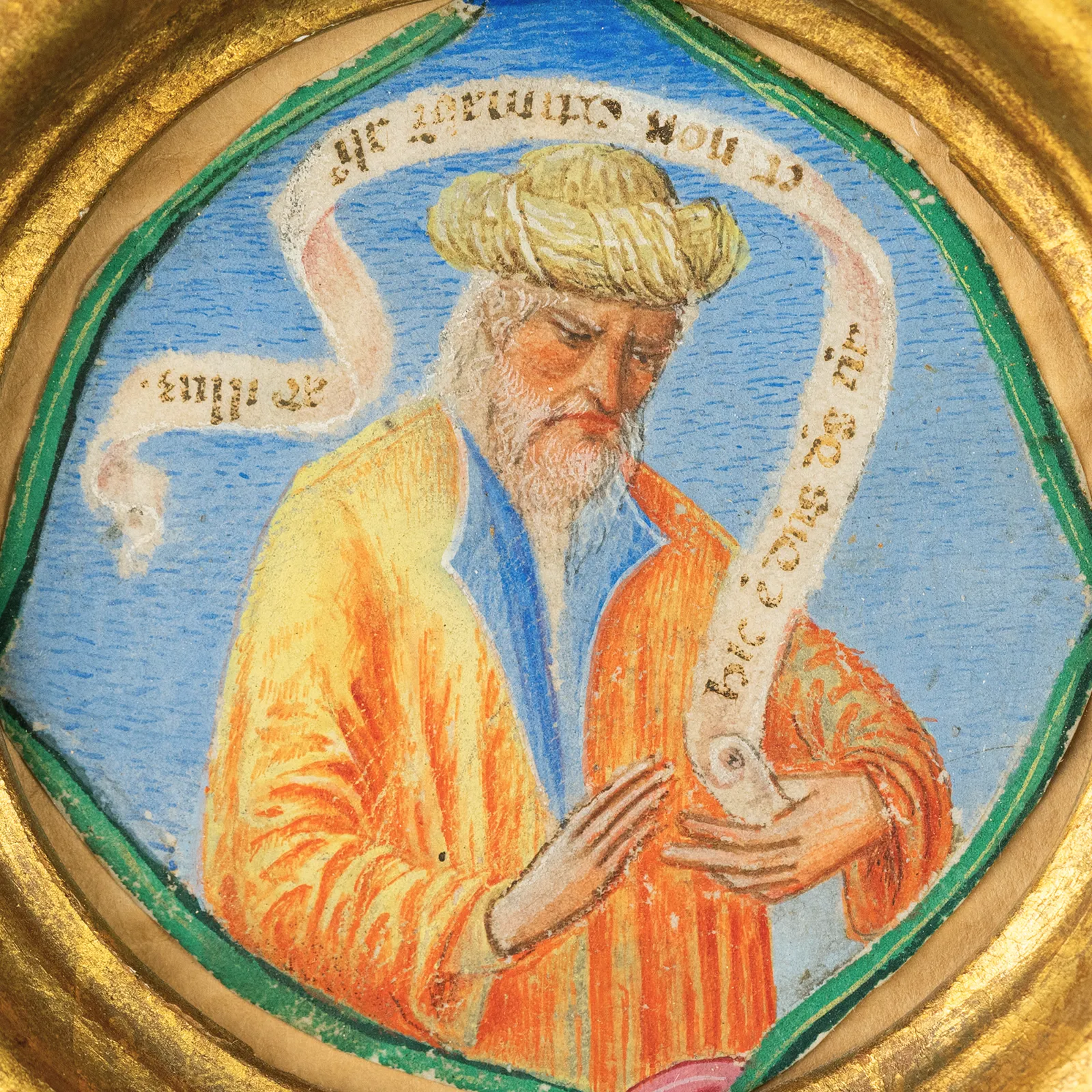 An Italian Renaissance miniature from an illuminated manuscript, depicting a Prophet with a turban and scroll by a Veronese Illuminator, late 15th century, circular gold frame.