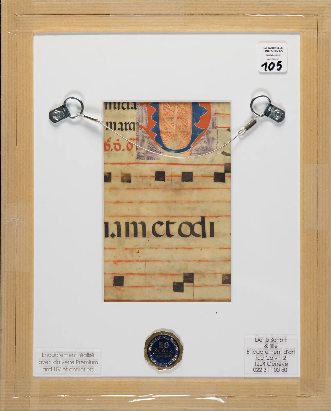 Verso view of a 20th-century Spanish Forger manuscript leaf, showing original Latin text on 15th-century parchment, musical notation, framed with gallery labels from La Gabrielle Fine Arts SA, Geneva, Switzerland.