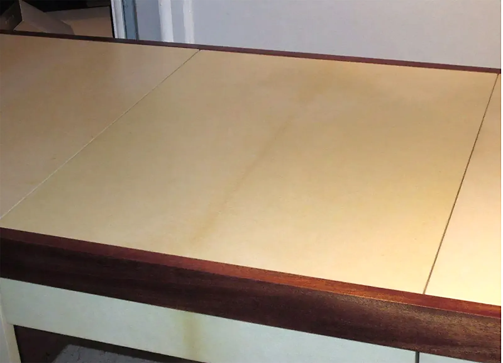 Custom Mahogany and Parchment Desk Featuring Three Central Drawers