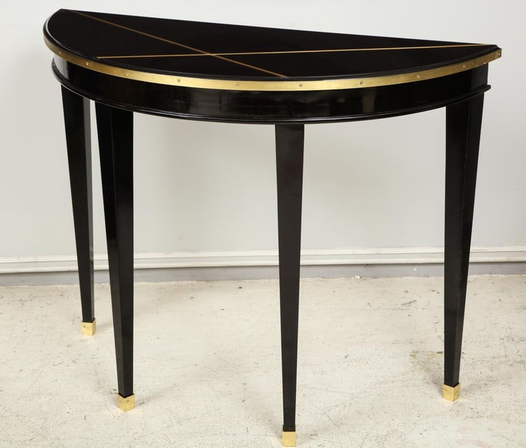 Custom Pair of Ebonized Demilune Consoles with Inlaid Brass Top