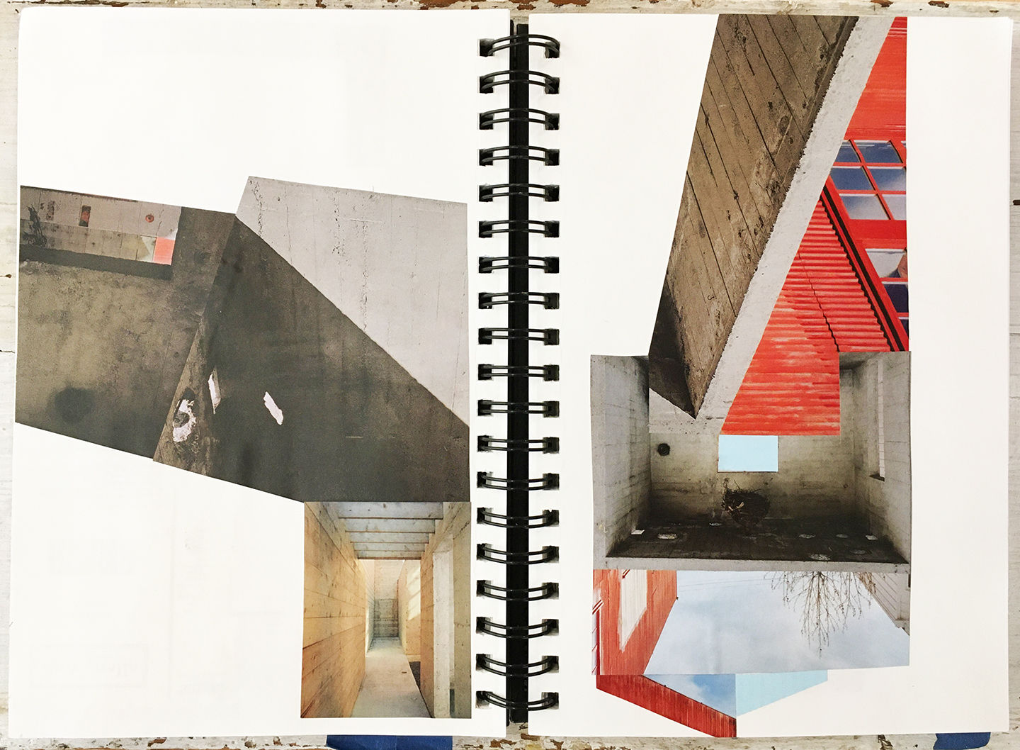 photo of open notebook with abstract collaged pages