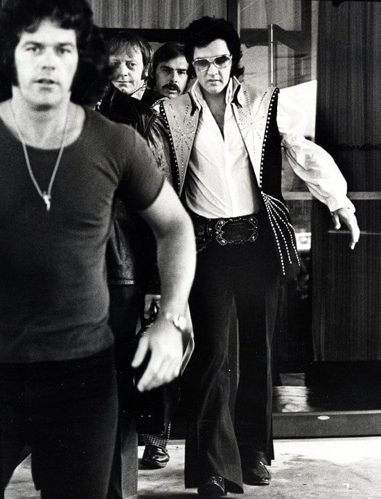 Ron Galella, Elvis and bodyguards depart the Hilton Hotel, Philadelphia, PA, June 25, 1974