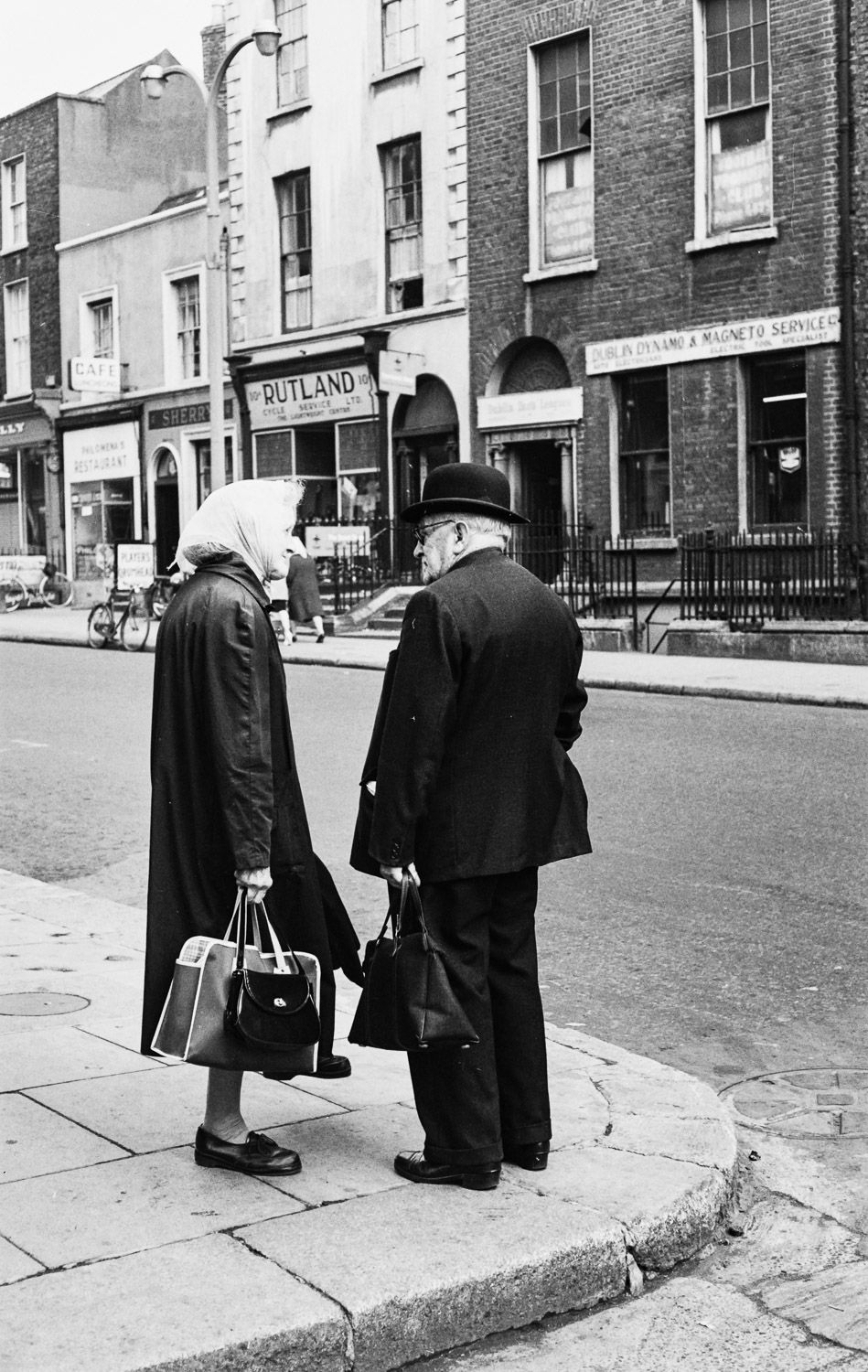 Edward Quinn, Old Couple on Corner, side street off O'Connell Street, Dublin 1963