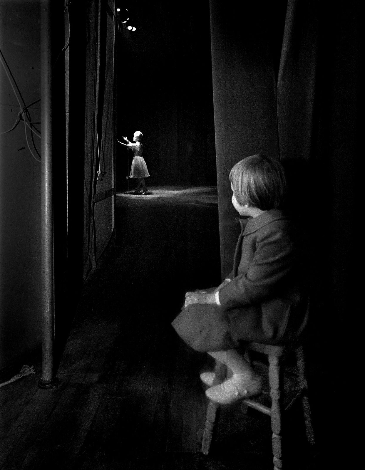 Lawrence Schiller, From the wings of the theater, Carrie Fisher patiently watches her mother, Debbie Reynolds, as she performs her cabaret act at the Riviera Hotel, Las Vegas, 1963