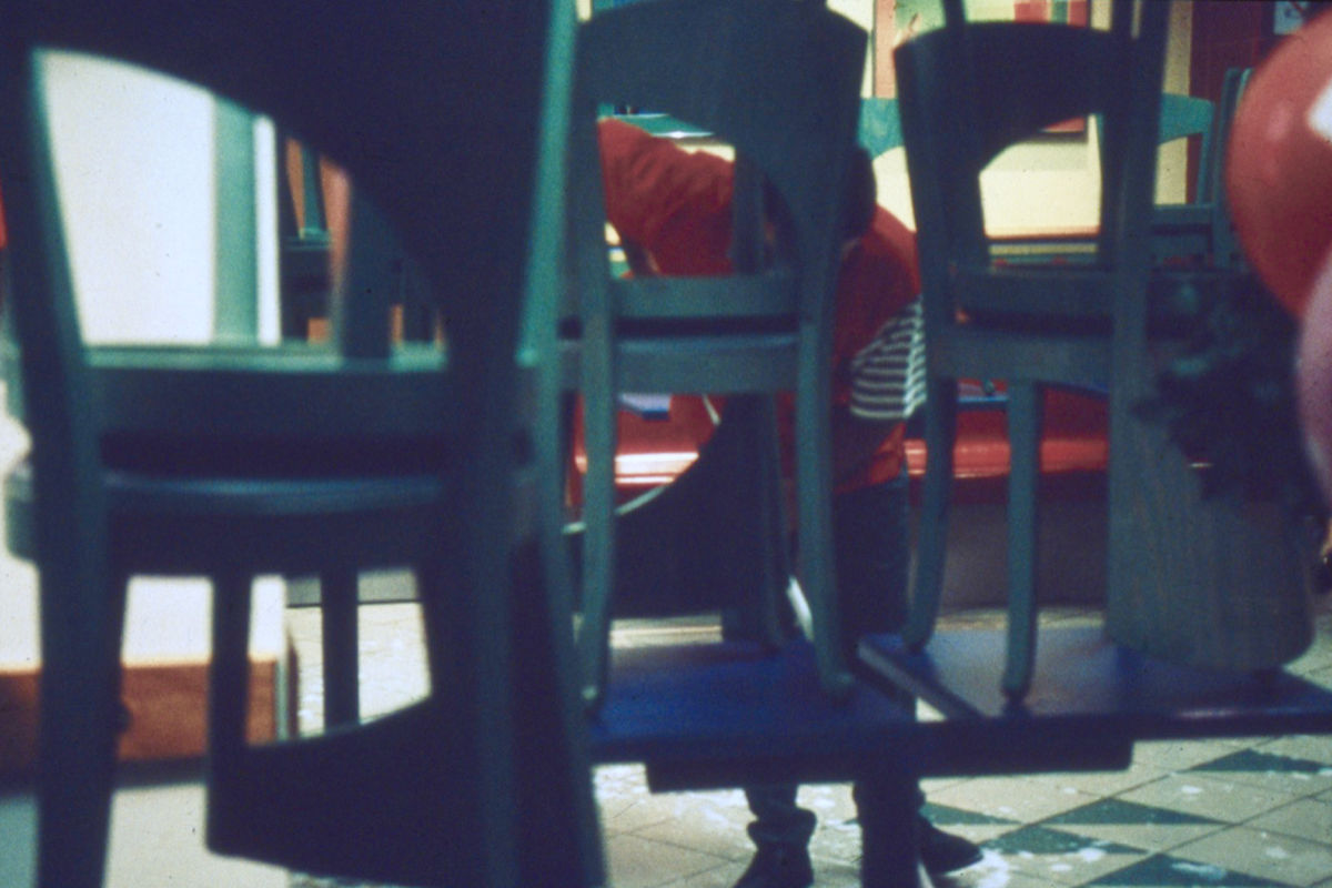 Louis Stettner, Red Man Sweeping, Porte de Clichy, 1998, printed 1998