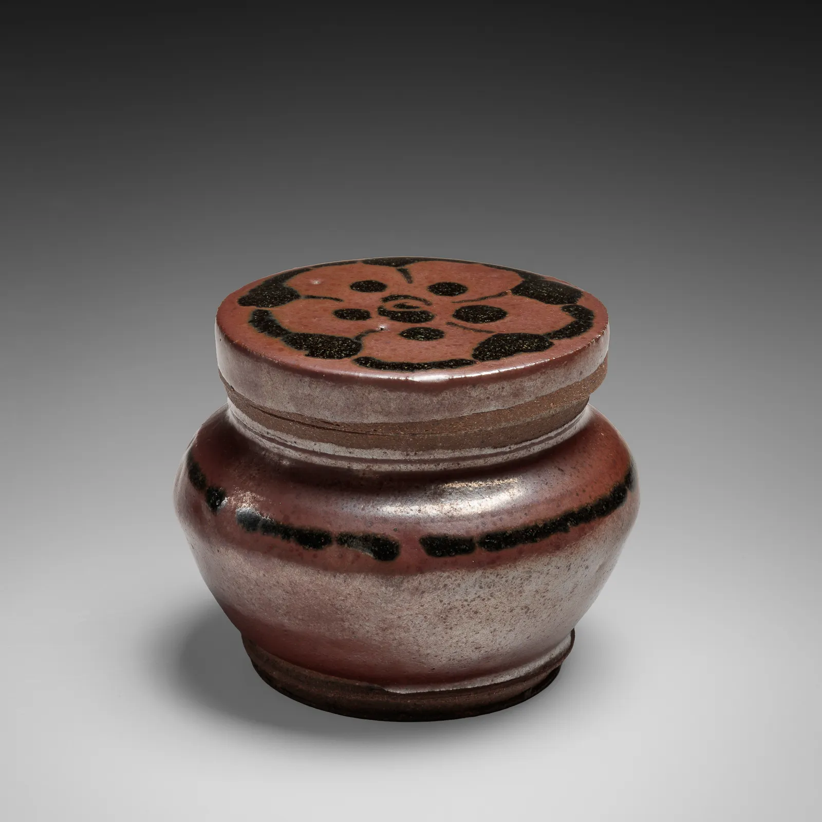 KAWAI KANJIRŌ, Iron-glazed covered box with stylized floral motif on lid, ca. 1930