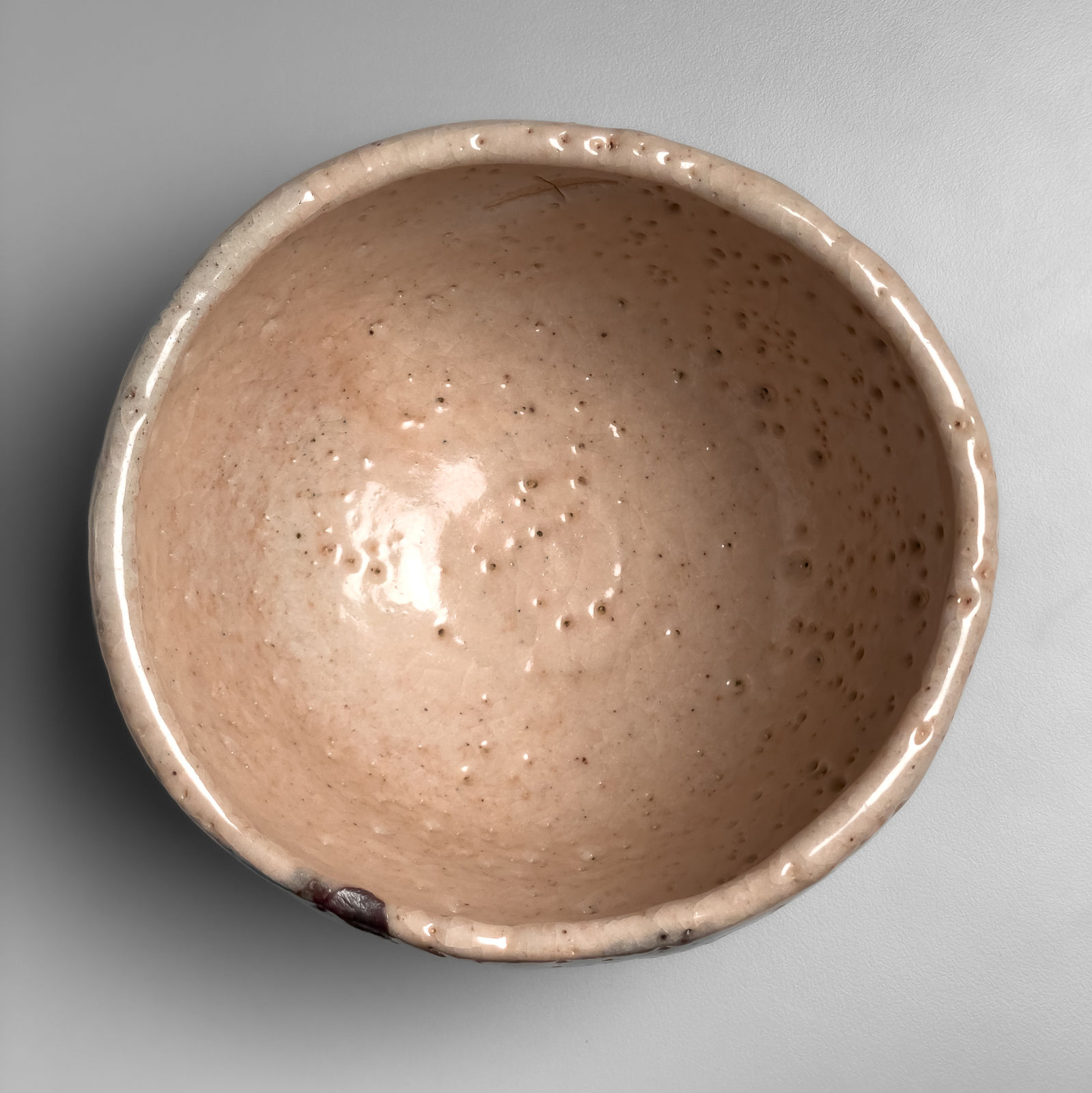 OKABE MINEO, E-Shino-glazed round teabowl with iron-oxide underglaze patterning, 1962