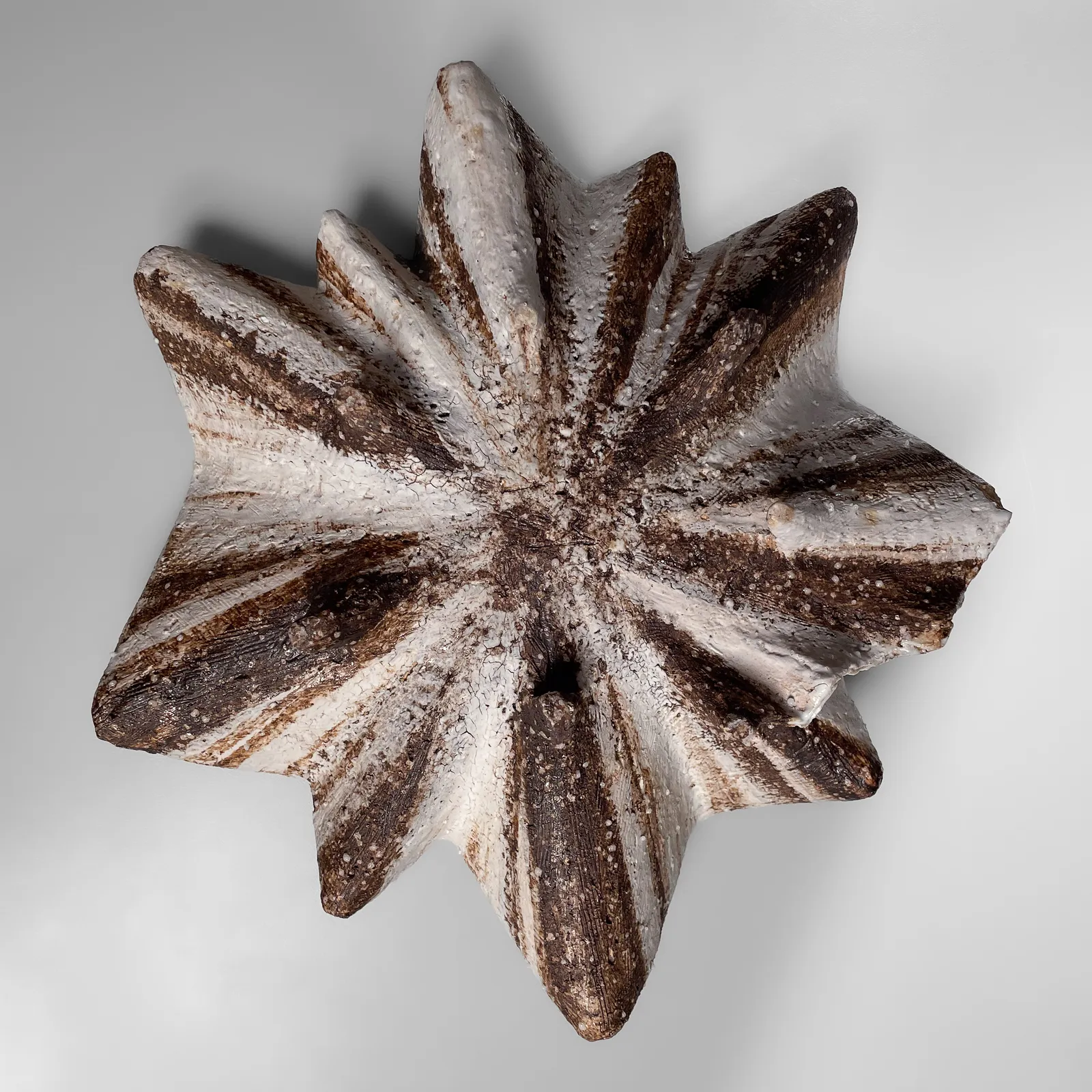 KOIKE SHŌKO, Low pleated shell-shaped vessel with white, iron-oxide, silver, and purple glazes, 1996