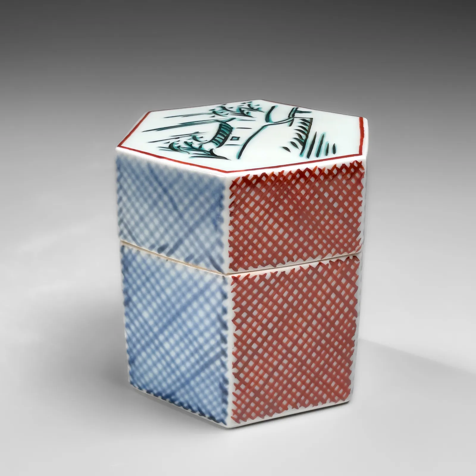 TOMIMOTO KENKICHI, Iro-e (enamel overglaze) hexagonal covered box with landscape motif of “Rain on the Yamato River”, 1960