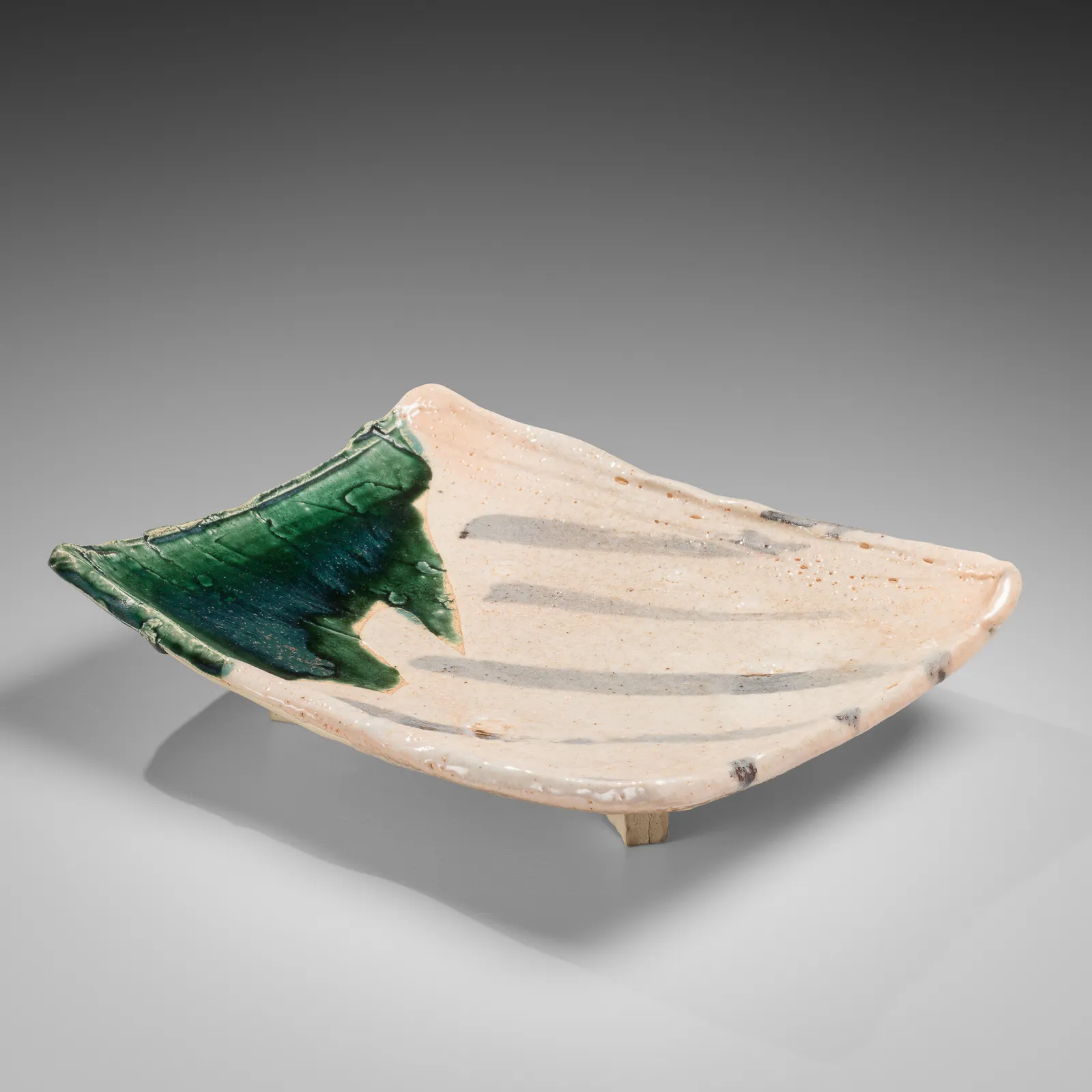 OKABE MINEO, Shino and Oribe-glazed rectangular platter with four feet, 1965