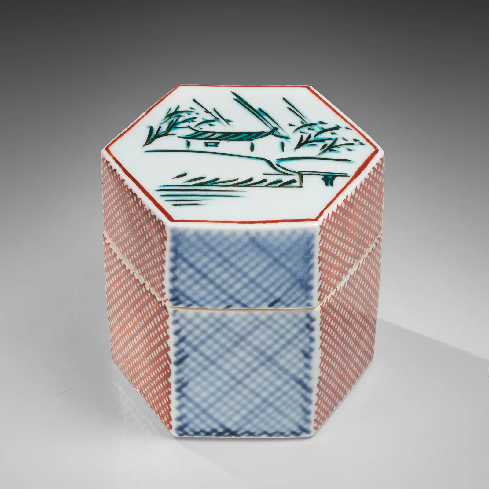 TOMIMOTO KENKICHI, Iro-e (enamel overglaze) hexagonal covered box with landscape motif of “Rain on the Yamato River”, 1960