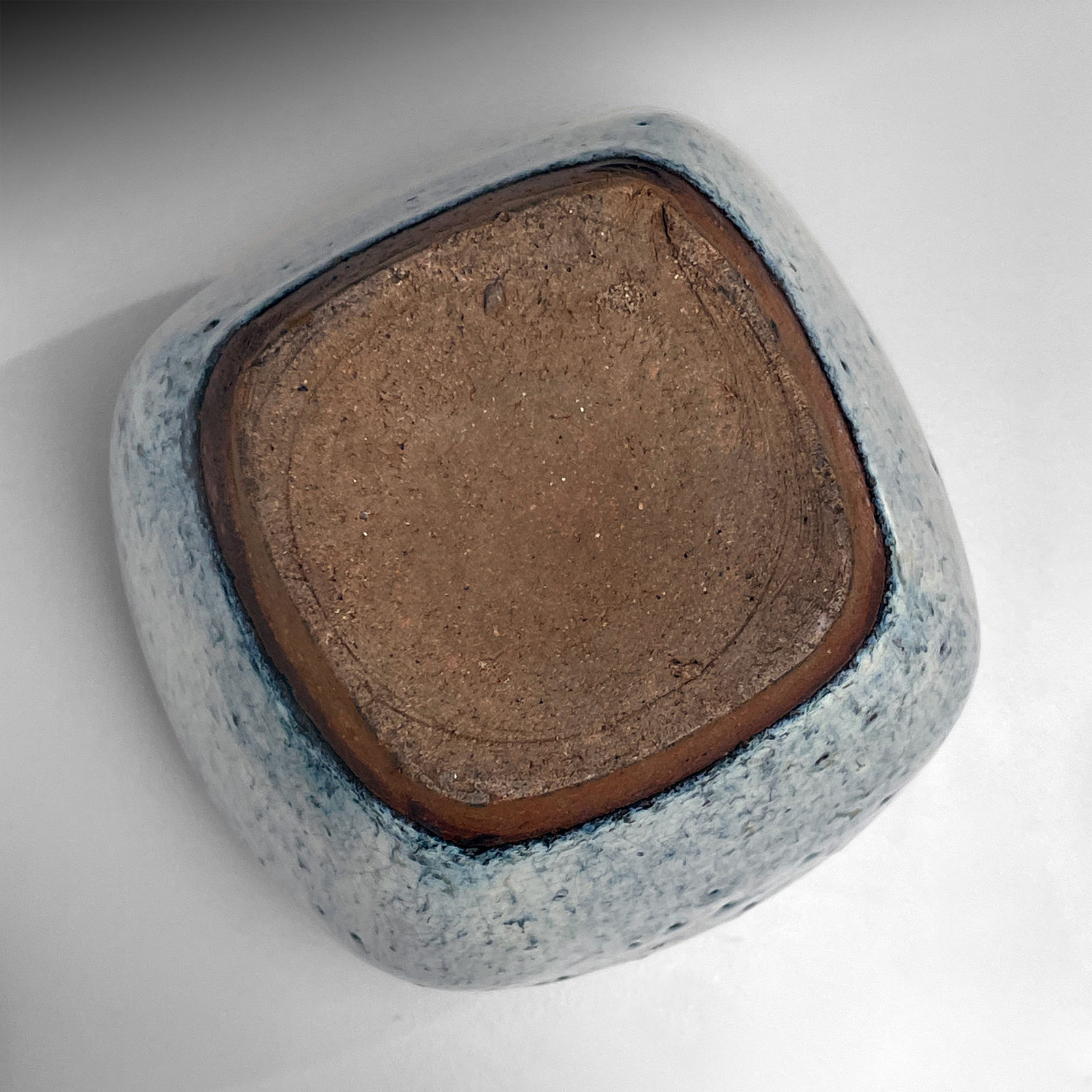 KAWAI KANJIRŌ, Tapering covered jar with squared-off sides and matching round lid in namako ("sea cucumber") glaze, 1930s