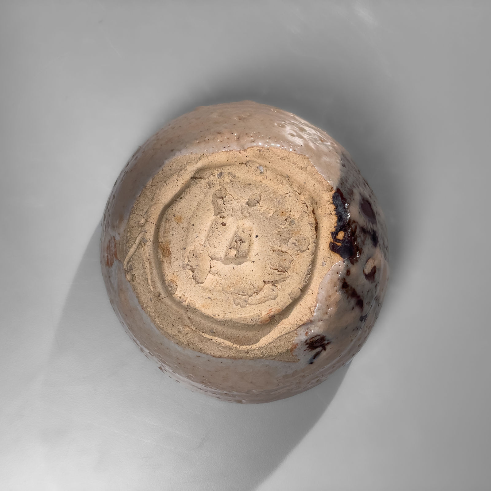 OKABE MINEO, E-Shino-glazed round teabowl with iron-oxide underglaze patterning, 1962
