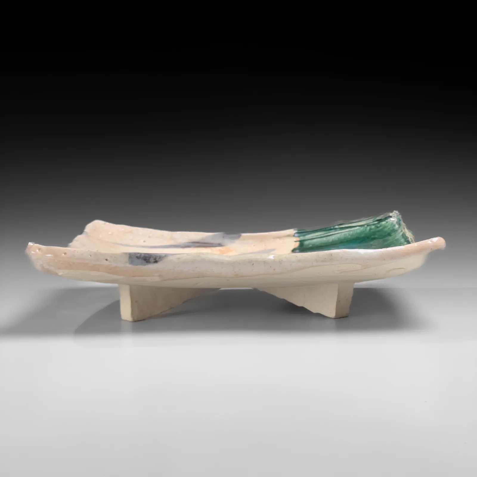 OKABE MINEO, Shino and Oribe-glazed rectangular platter with four feet, 1965