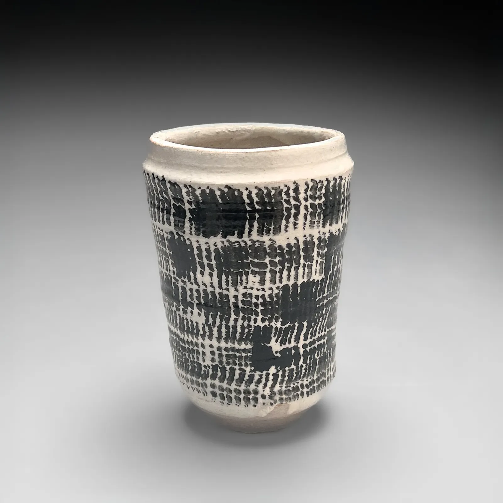 ISHIGURO MUNEMARO, Small cylindrical vessel with black rope-patterning design on white ground, Late 1940s-50s