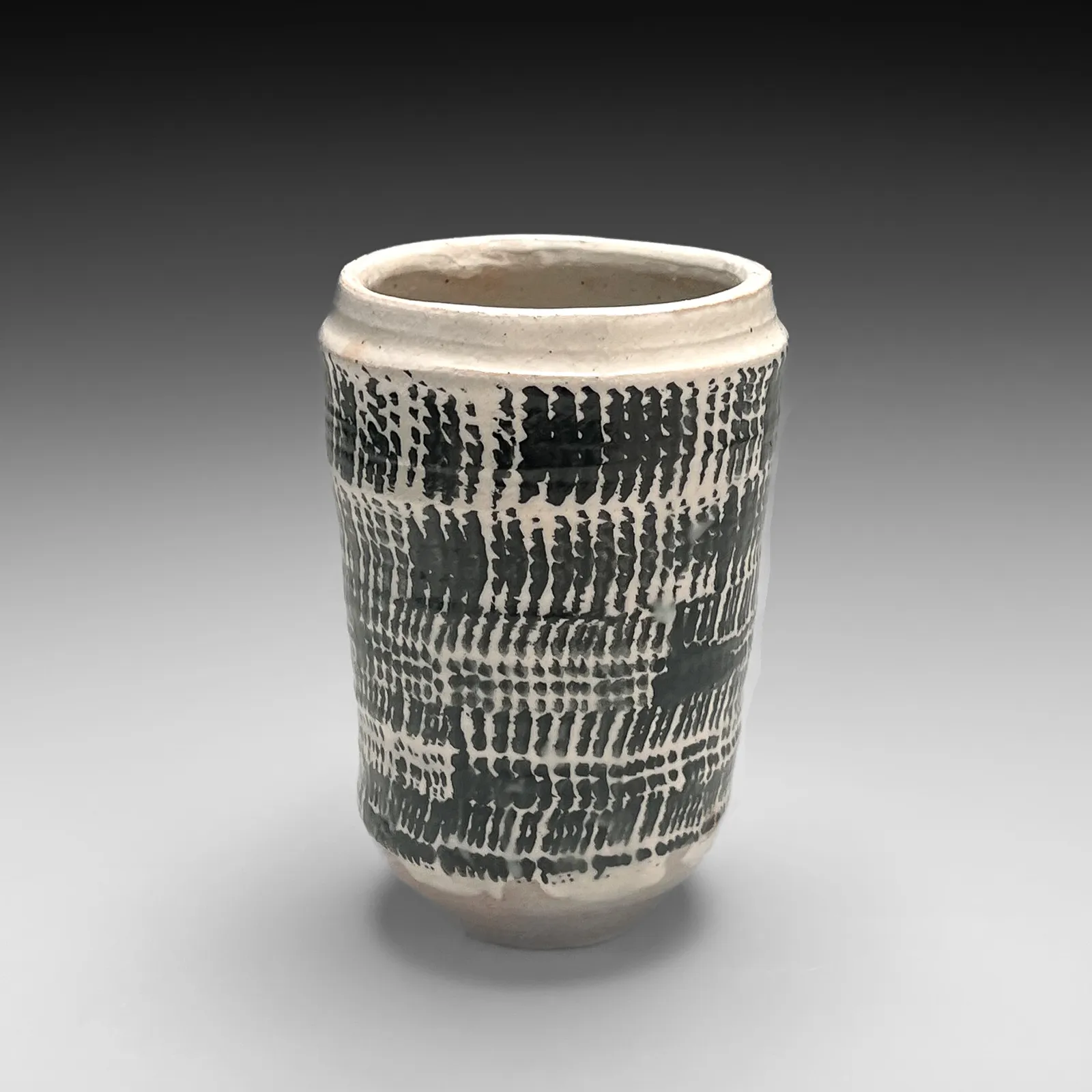ISHIGURO MUNEMARO, Small cylindrical vessel with black rope-patterning design on white ground, Late 1940s-50s