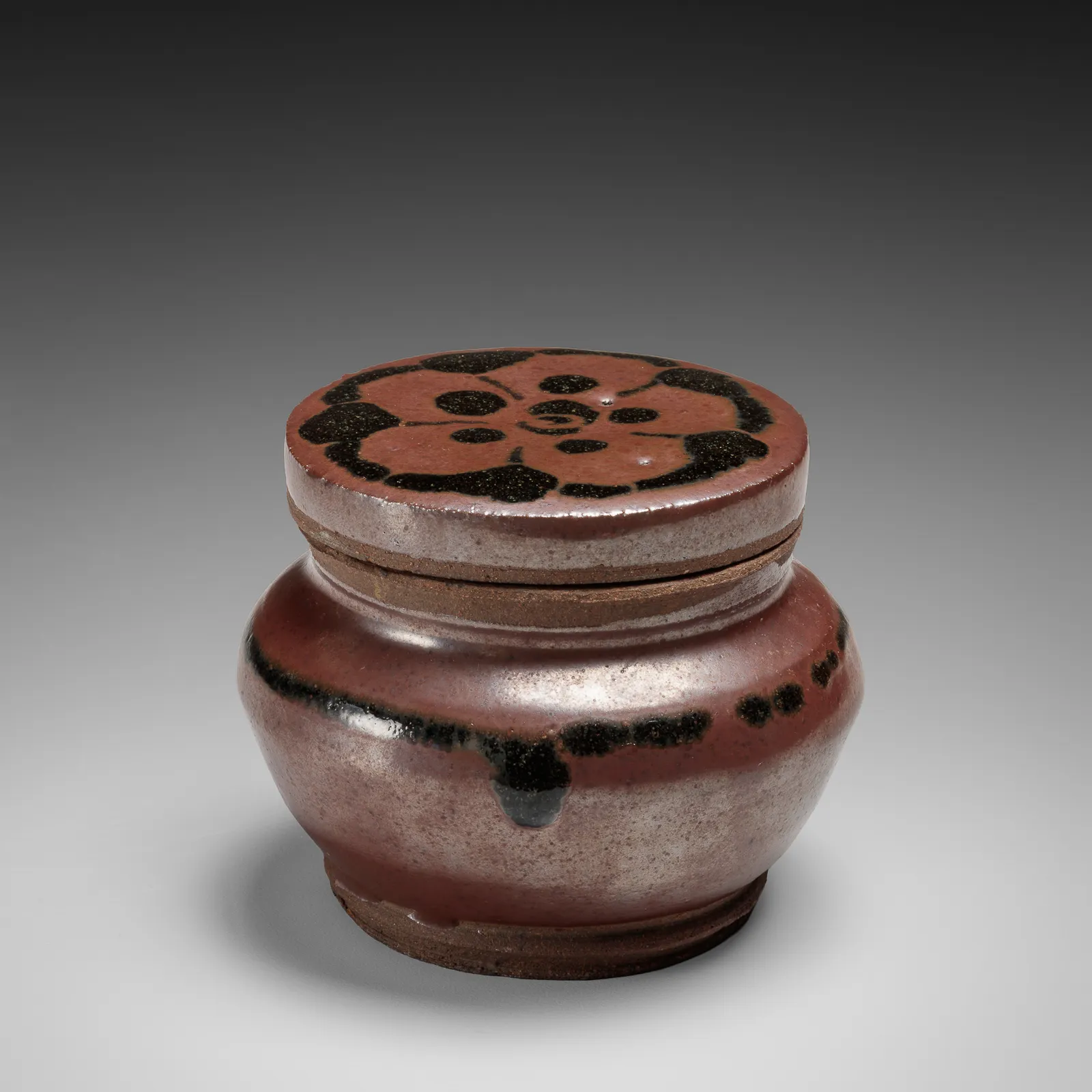KAWAI KANJIRŌ, Iron-glazed covered box with stylized floral motif on lid, ca. 1930