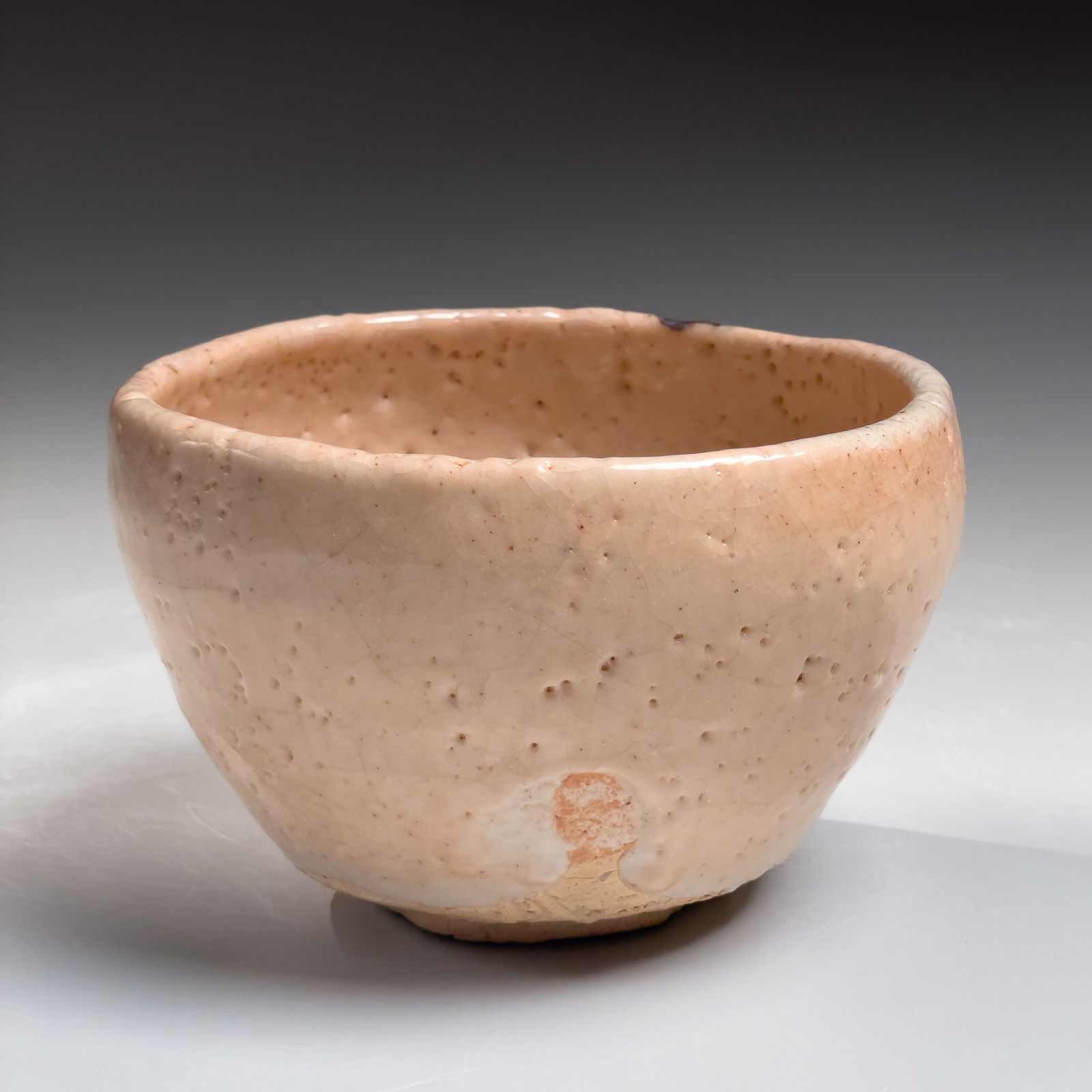 OKABE MINEO, E-Shino-glazed round teabowl with iron-oxide underglaze patterning, 1962