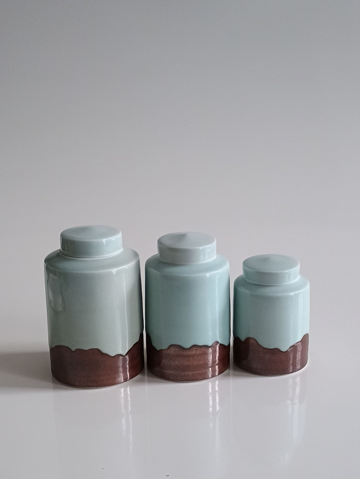 Chris Keenan, Celadon and Red Lidded Jars (smaller/right), 2025