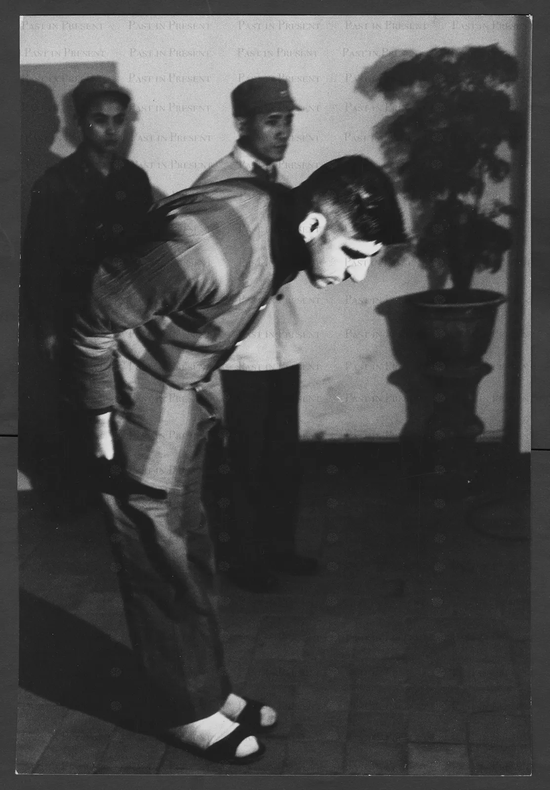 Bowing American prisoner at Hanoi Press Conference.