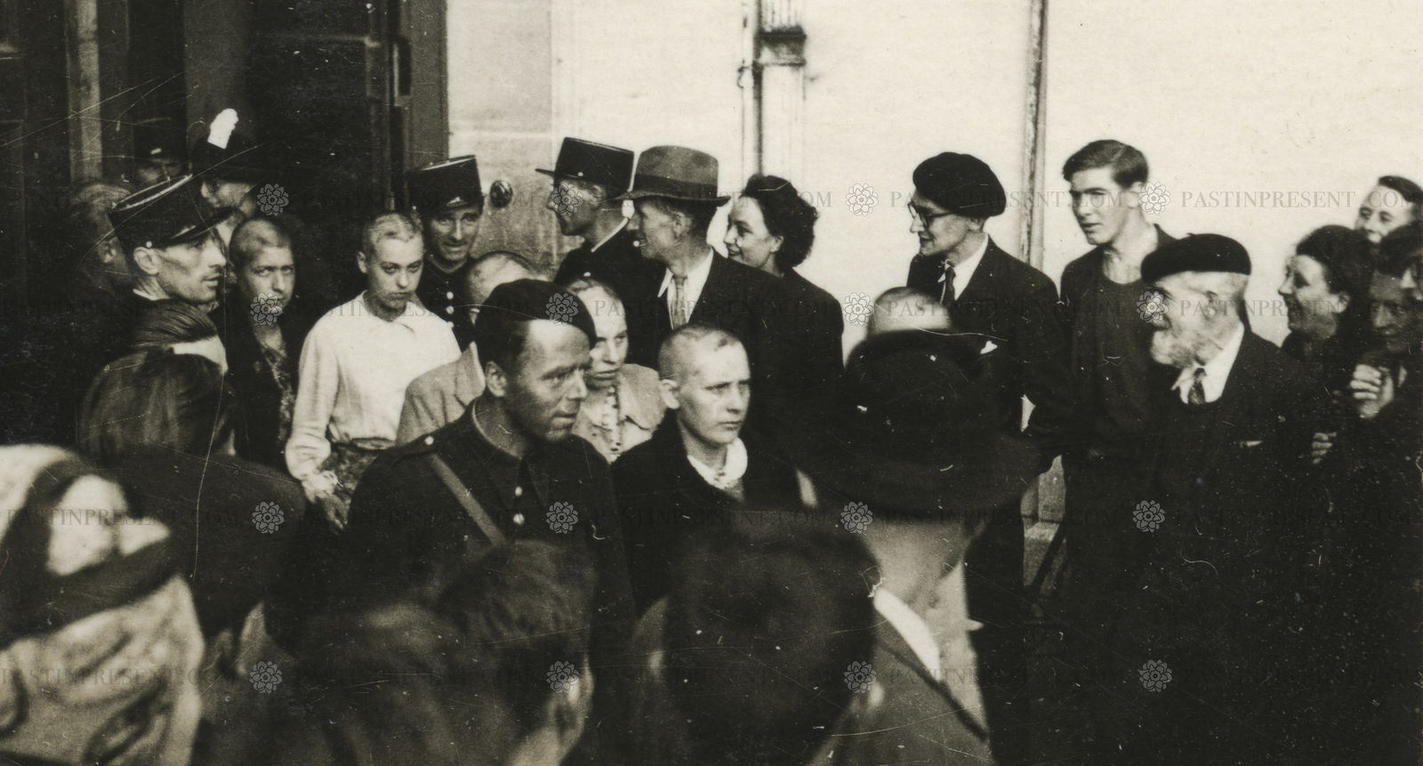 French Resistance Fighters shaving heads of female traitors brothel Aux Belle Poules, Paris , 1944