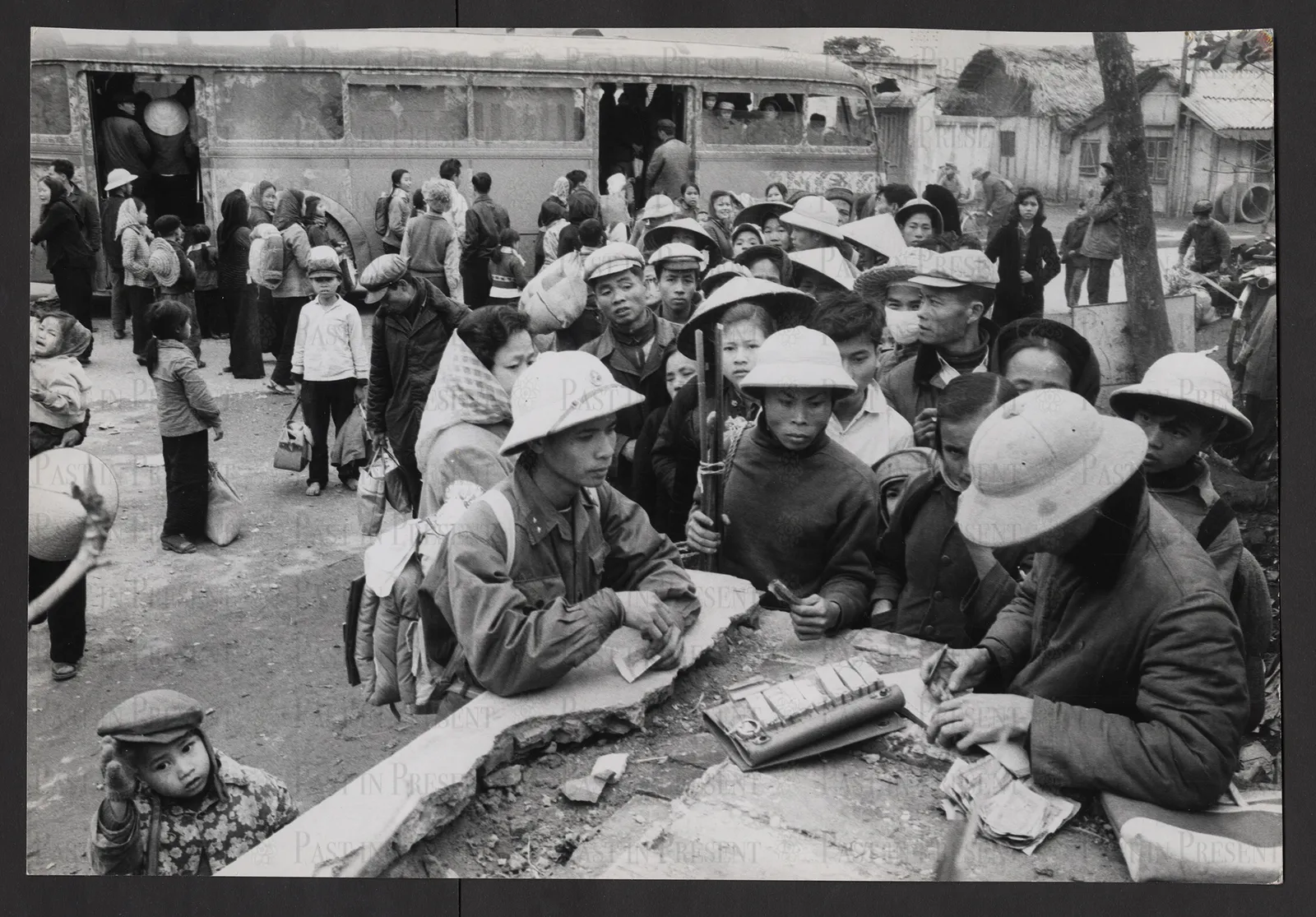 At the end of the Tet Holiday, children who had been brought back into the city for the celebration, are being re-evacuated into rural areas.