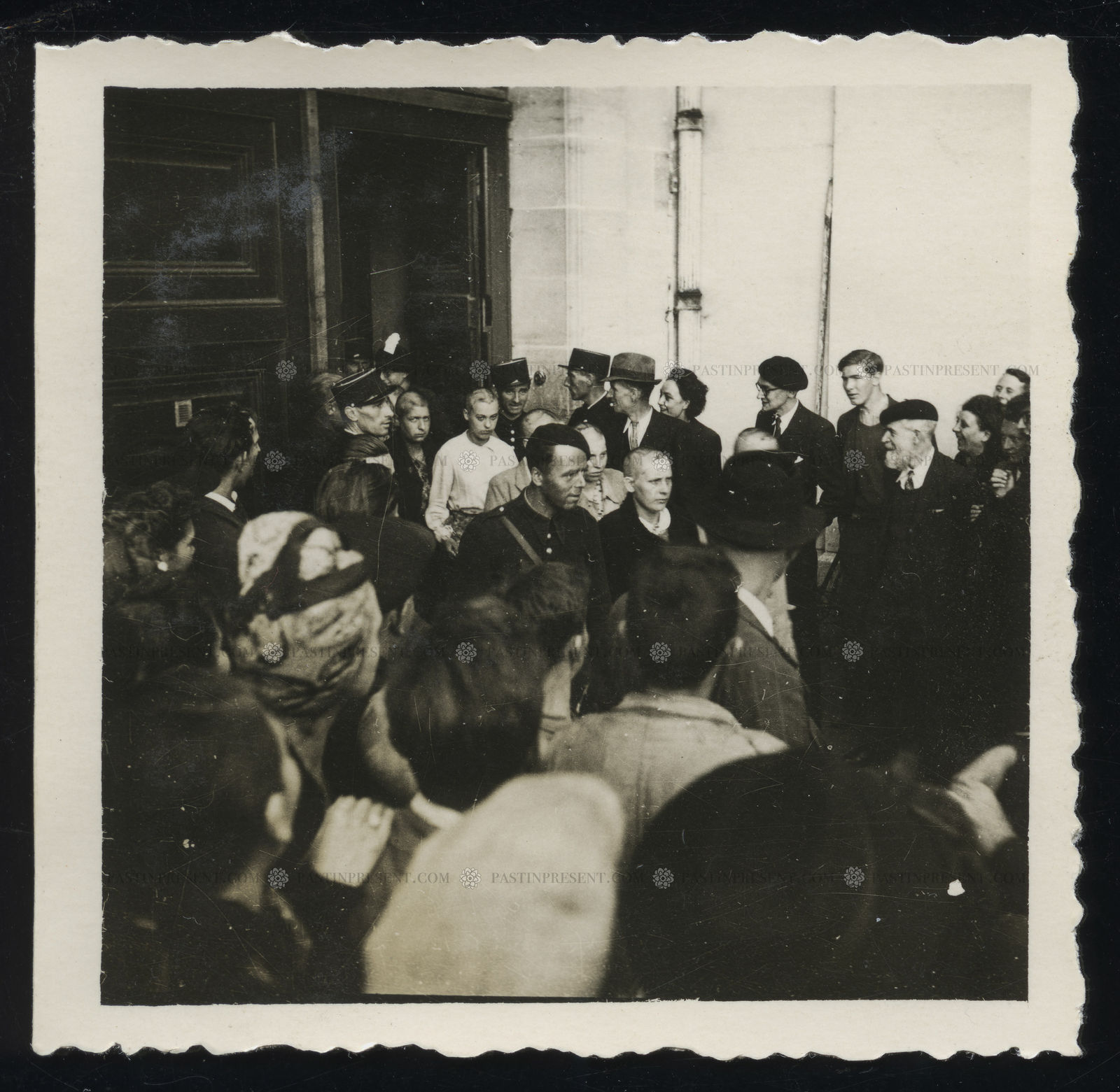 French Resistance Fighters shaving heads of female traitors brothel Aux Belle Poules, Paris , 1944