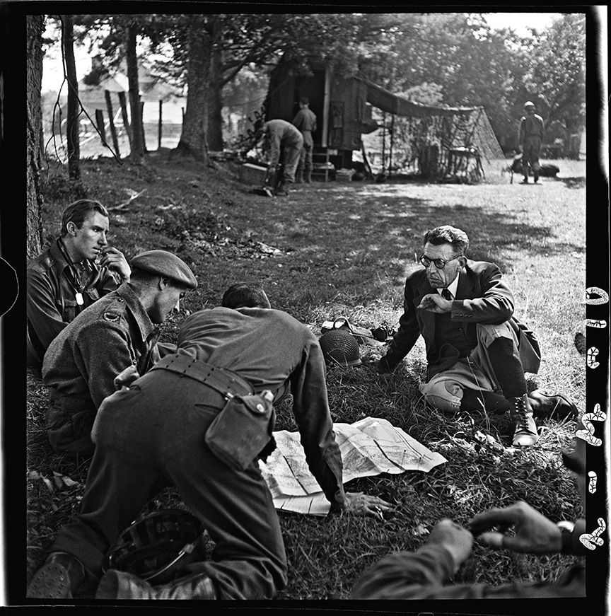 John G. Morris, #18 Near Saint-Malo, Ille-et-Vilaine, Brittany, August 8: British and Canadian war correspondents with a local official