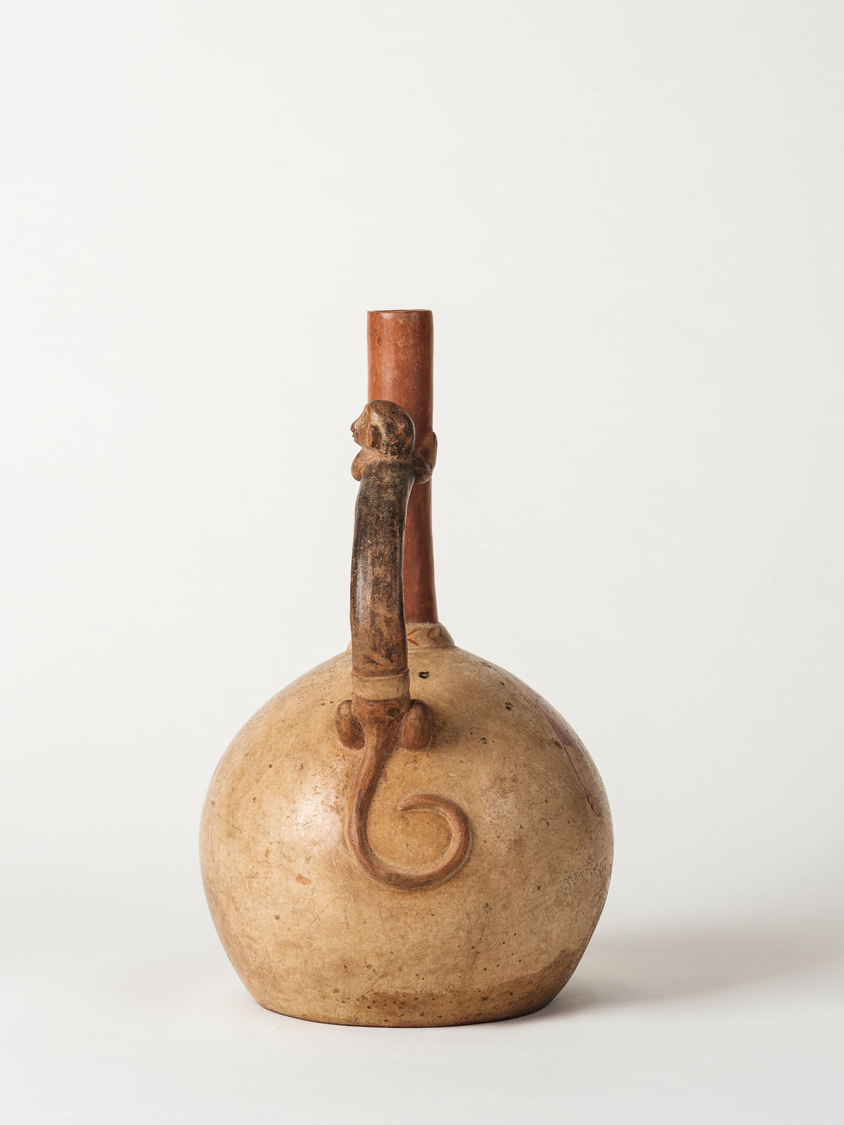 Moche Culture, Moche Fineline Stirrup Vessel Monkey on Handle, Circa. 400-700 AD