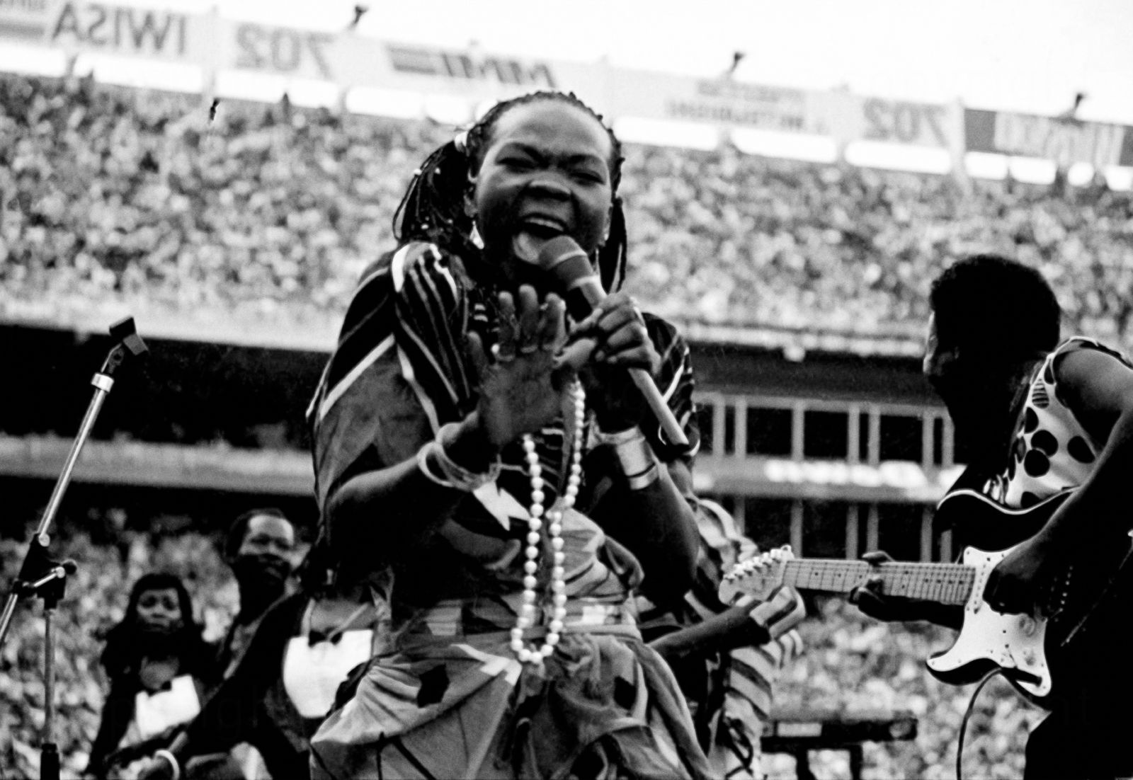 Alf Kumalo, Brenda Fassie performing at Ellis Park, Johannesburg, April 1984