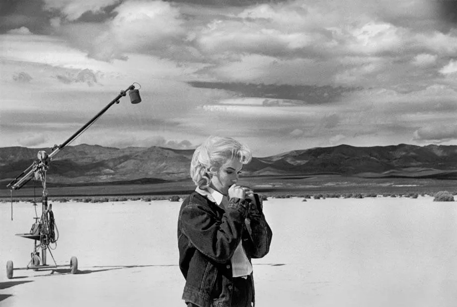 Eve Arnold, Marilyn Monroe, on the Nevada desert going over her lines for a difficult scene she is about to play with Clark Gable in the film, "The Misfits" by John Huston, 1960, printed later