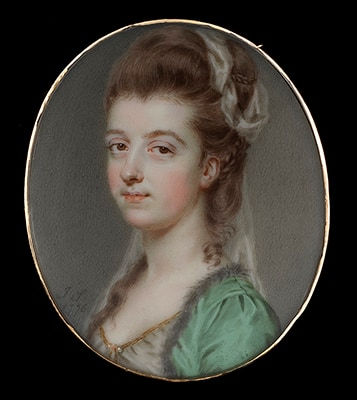 John Smart, Portrait miniature of a Lady, wearing green coat with fur trim, white dress trimmed with gold, upswept curling brown hair decorated with white gauze, 1776