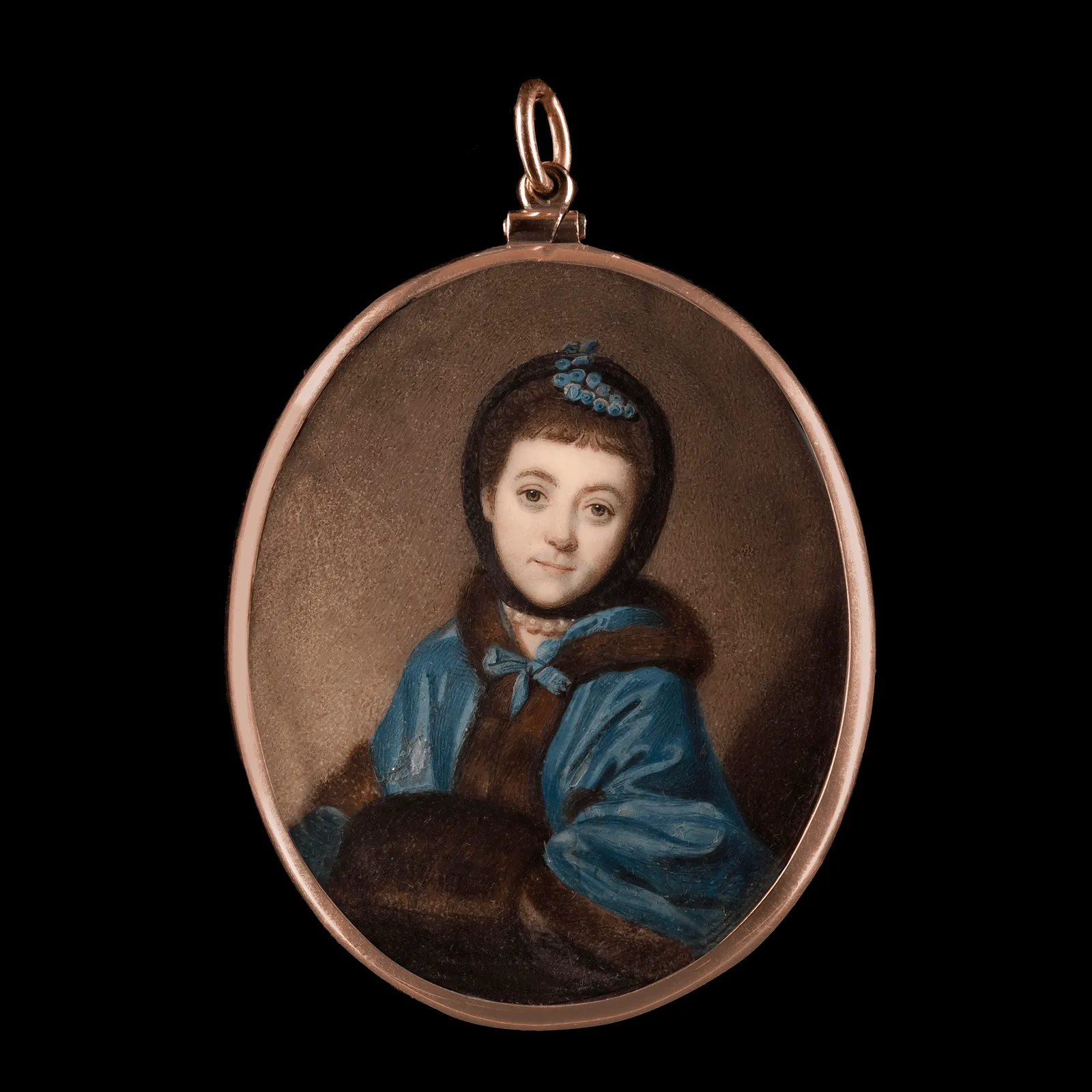 Richard Cosway, Portrait of a young girl, wearing blue fur-trimmed cape, fur muff, her hair covered with black headscarf, pearls at her neck, c. 1765