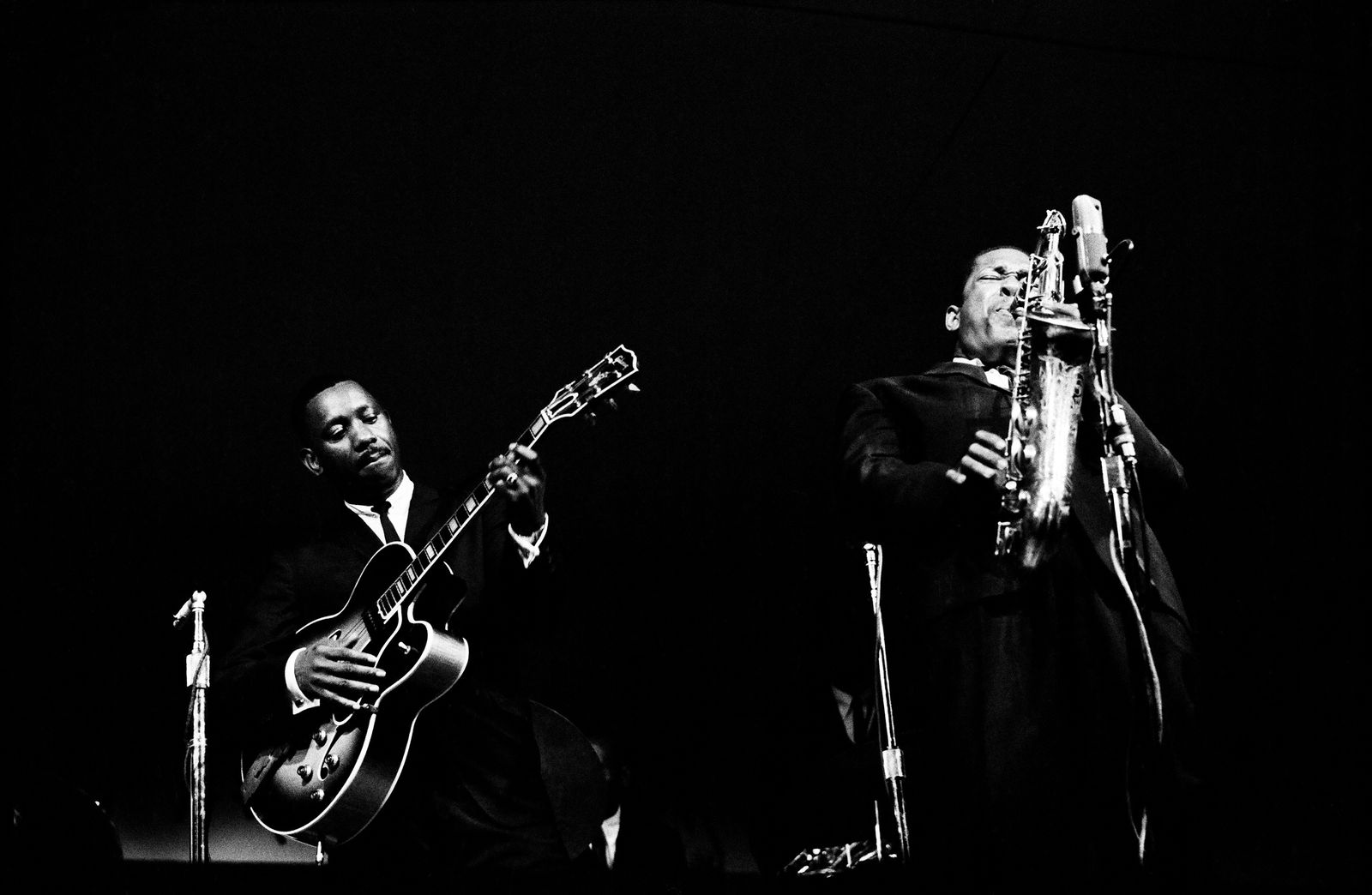 Black and white photograph by Jim Marshall of John Coltrane and Wes Montgomery available at the Rebecca Hossack Art Gallery.