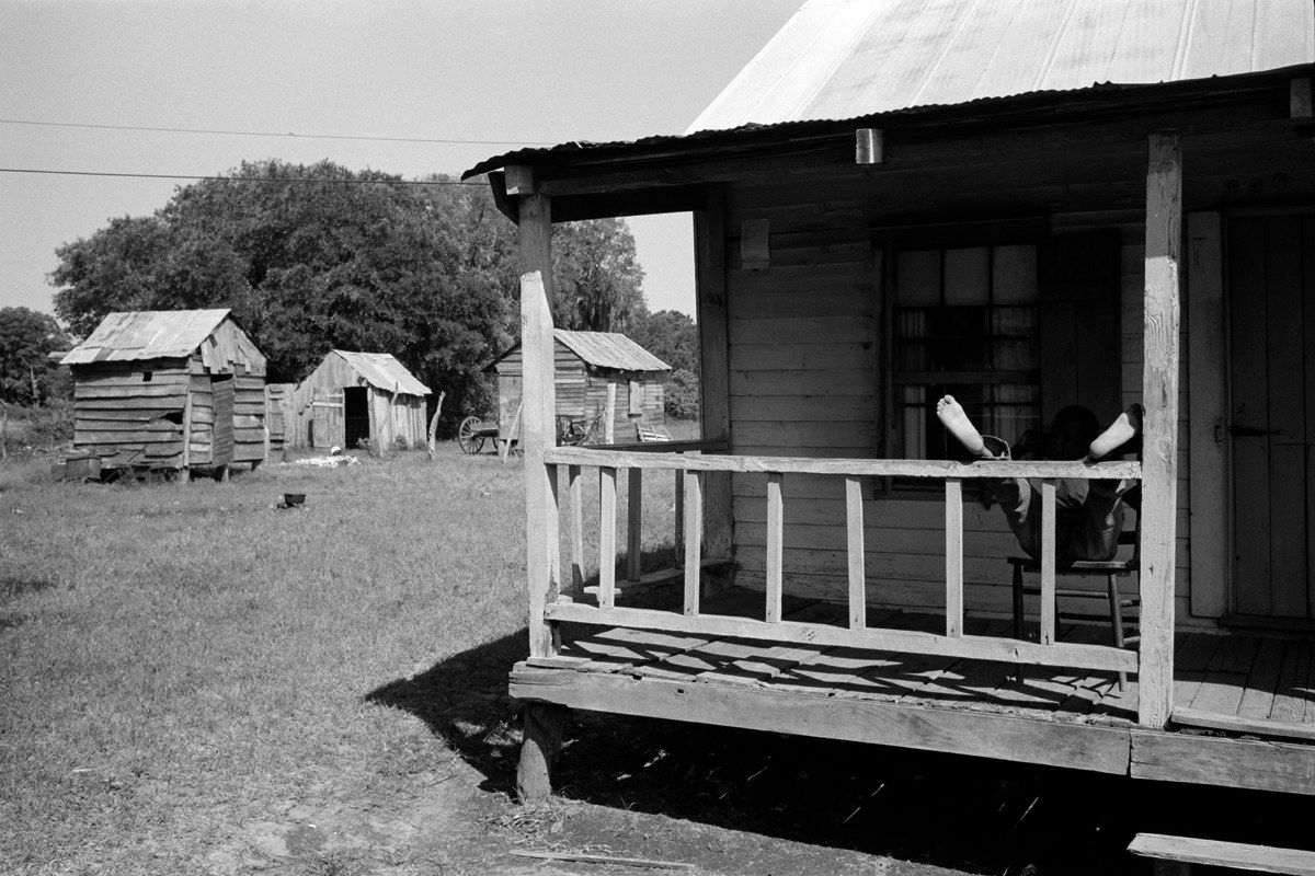 Constantine Manos, Island Boy, South Carolina, (Feet on porch rail), 1952