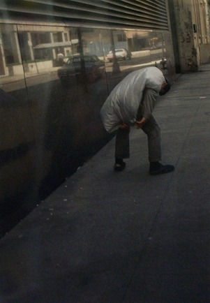 Helen Levitt, Untitled, New York (man with garment bag on back), 1971