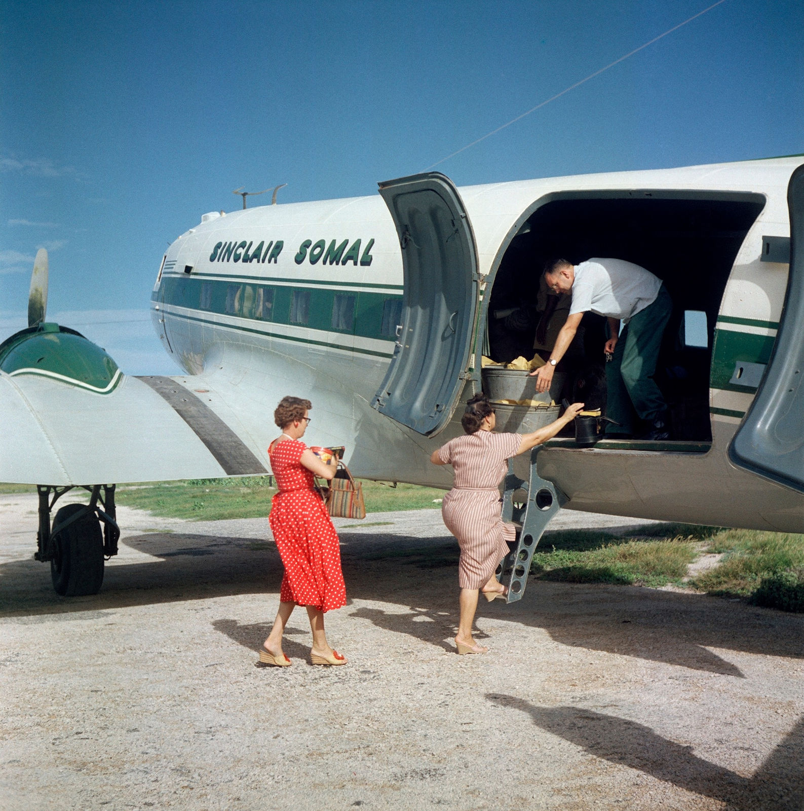 Todd Webb, Somalia Airplane Red Dress, Sinclair Somal, 1958