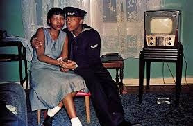 Guy Stricherz, Americans in Kodachrome 1945-1965 Sailor with Lady, Erie, Pennsylvania, 1951 Photographer: Hayes W. Houston