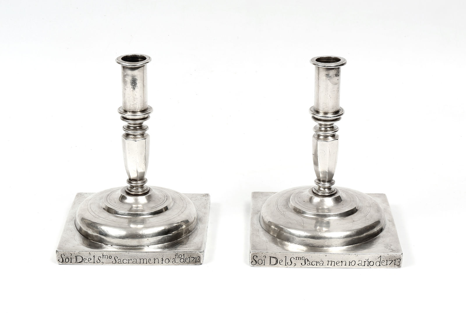 A pair of 17th century Portuguese silver candlesticks, Portugal; 17th century, later 1713 inscription