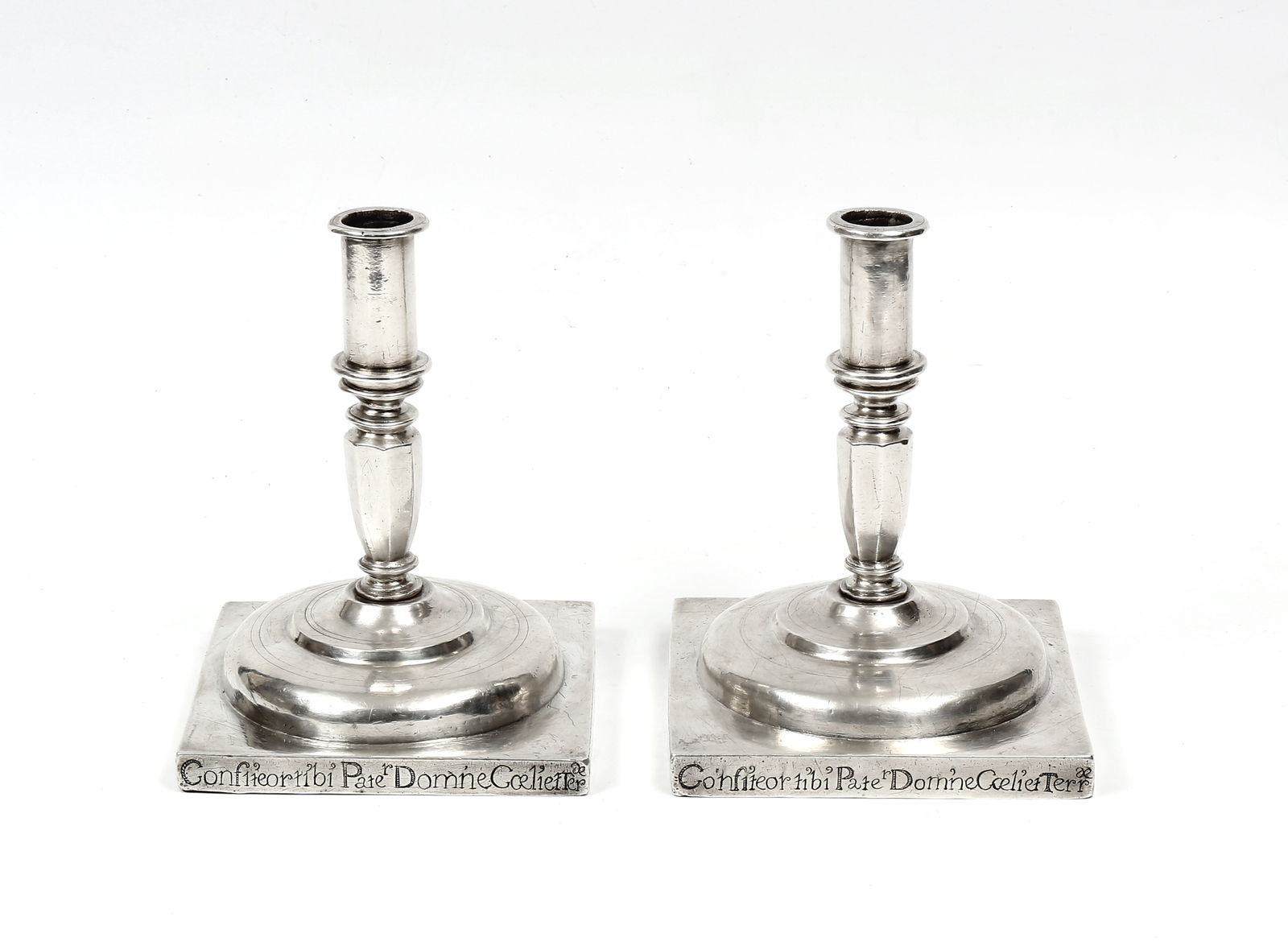 A pair of 17th century Portuguese silver candlesticks, Portugal; 17th century, later 1713 inscription