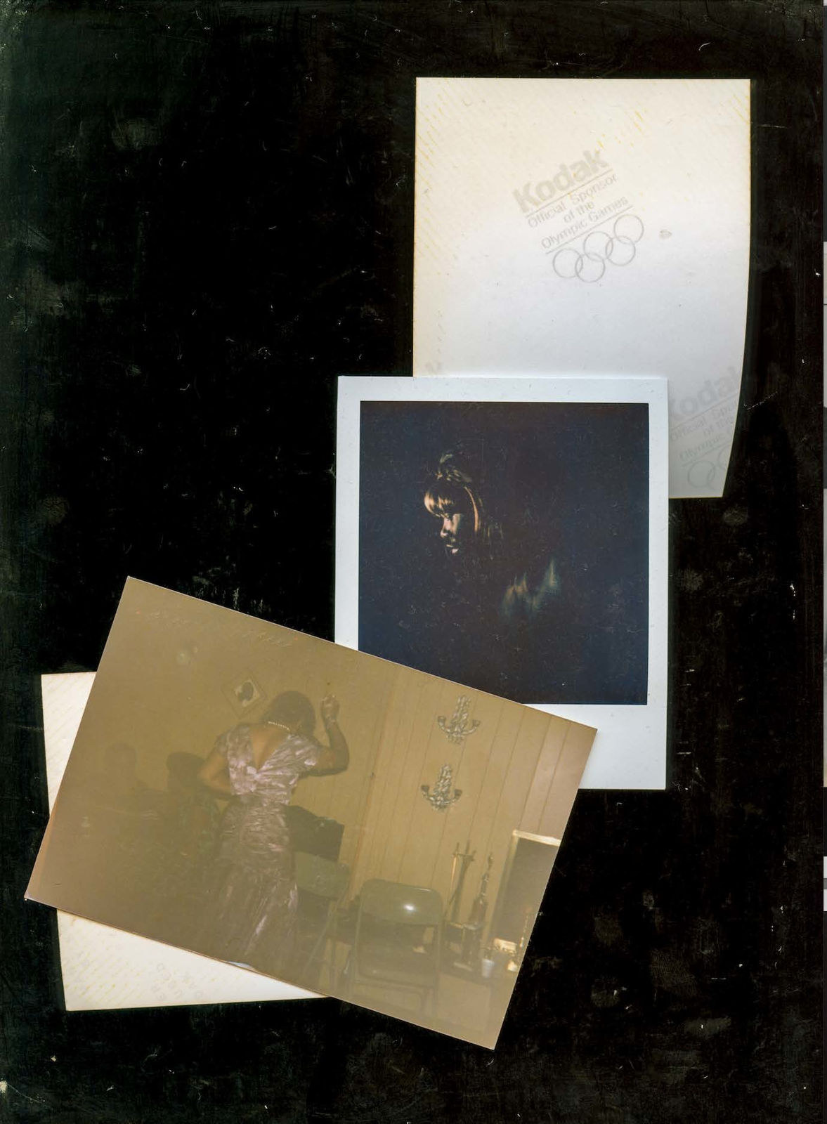 A scanned collage by Shabez Jamal showing faded or discolored family photographs intermixed with contemporary self portraits of the artist. Dust and smudges from the scanner plate surround each photograph.