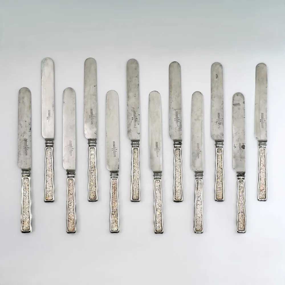 Tiffany & Co., A Set of Twelve Antique American Mokume Silver Knives, c. 1890