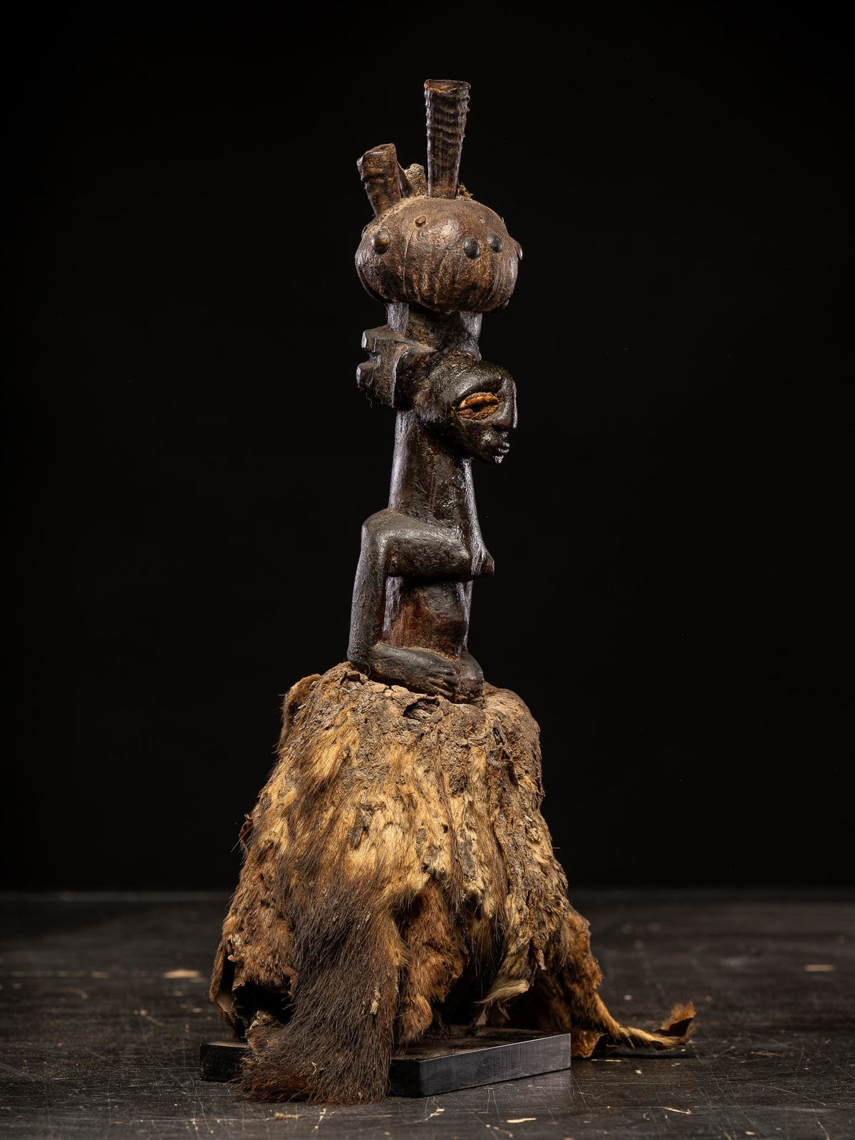 Power figure with cauris inlaid eyes topped with small antilope horns. Kusu People, DRC, 1st half 20th C