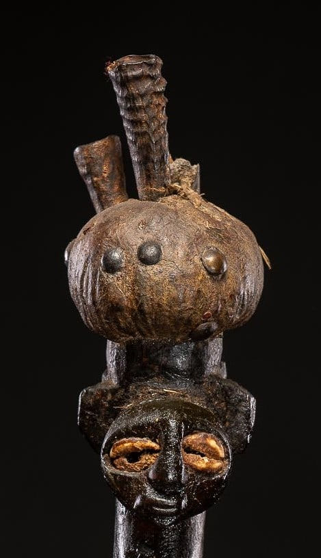 Power figure with cauris inlaid eyes topped with small antilope horns. Kusu People, DRC, 1st half 20th C
