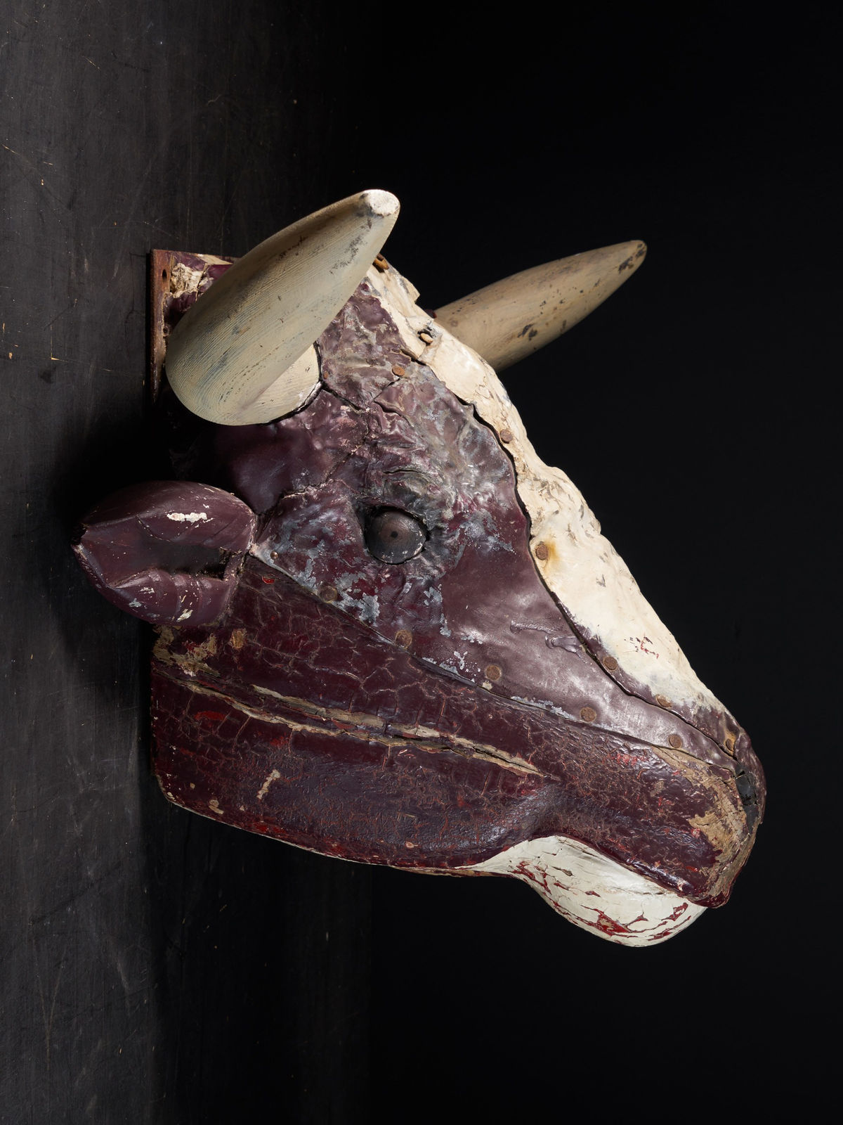 19 th C Butcher's Exterior Shop Sign of a wooden Steer Head covered with polychromed weathered lead, 1st half 19th Century