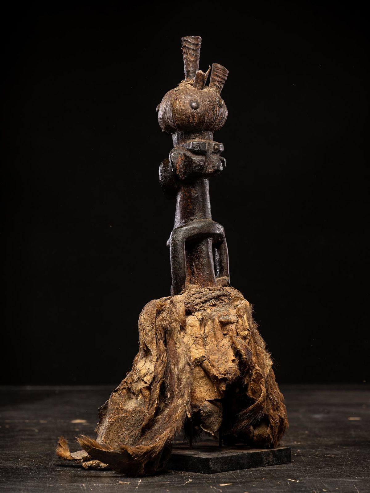 Power figure with cauris inlaid eyes topped with small antilope horns. Kusu People, DRC, 1st half 20th C