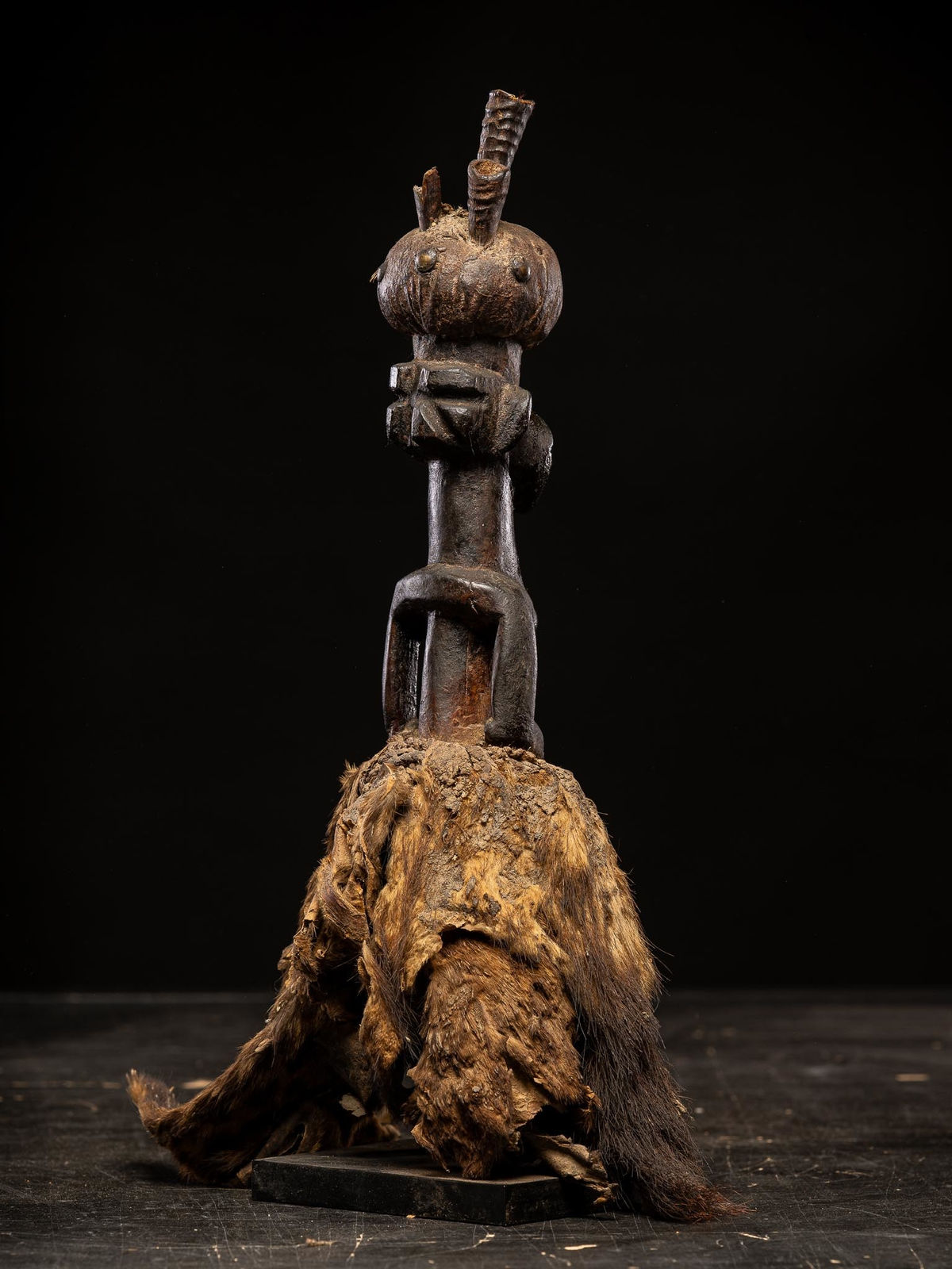 Power figure with cauris inlaid eyes topped with small antilope horns. Kusu People, DRC, 1st half 20th C