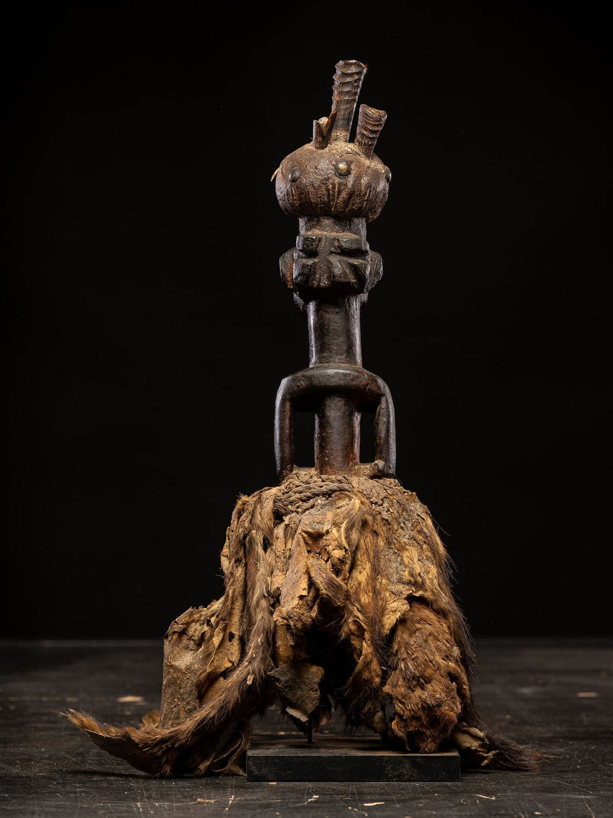 Power figure with cauris inlaid eyes topped with small antilope horns. Kusu People, DRC, 1st half 20th C