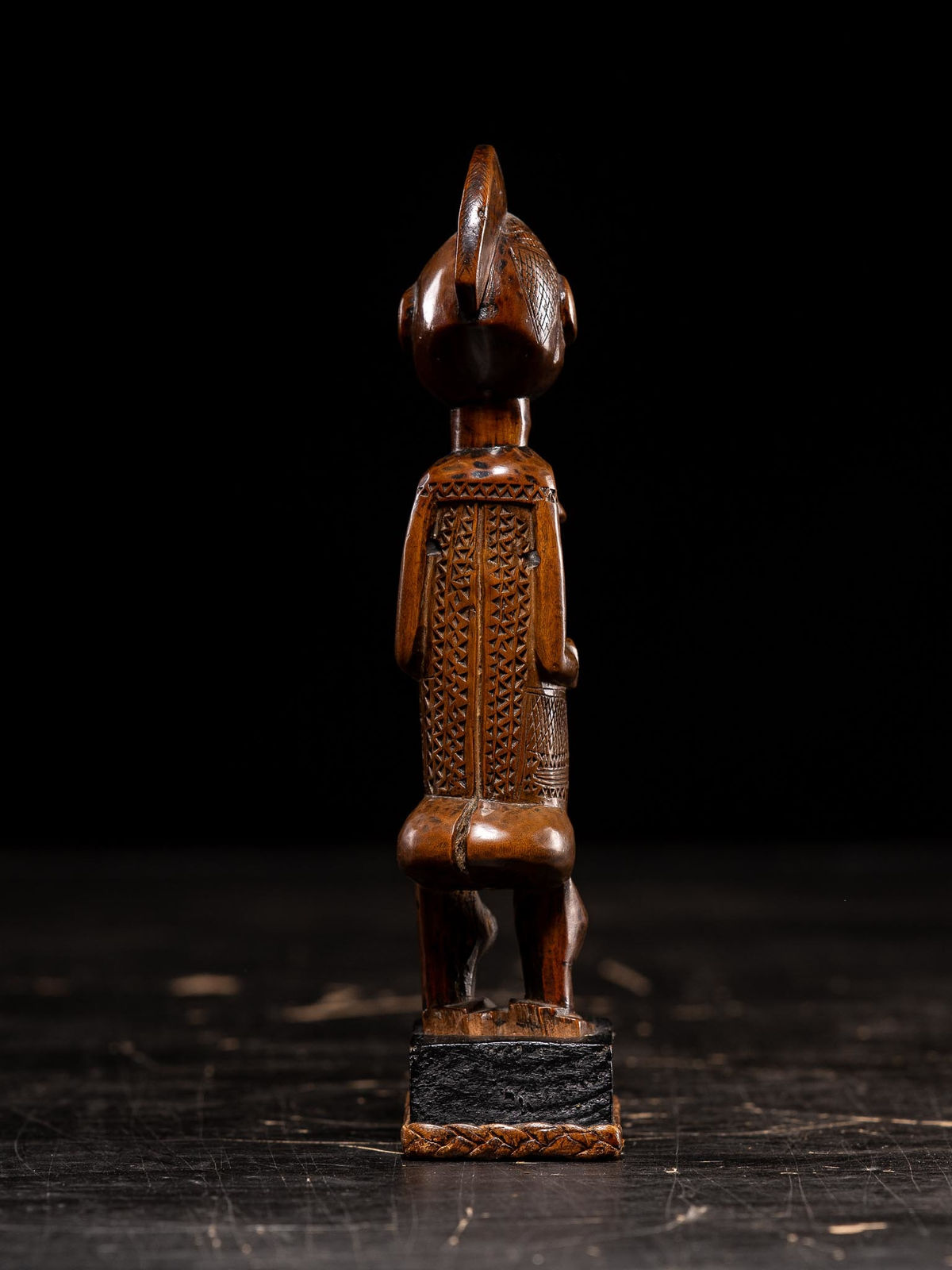Female standing scarified Figure on old colonial stand, Bwende People, DRC, 1st half 20th C